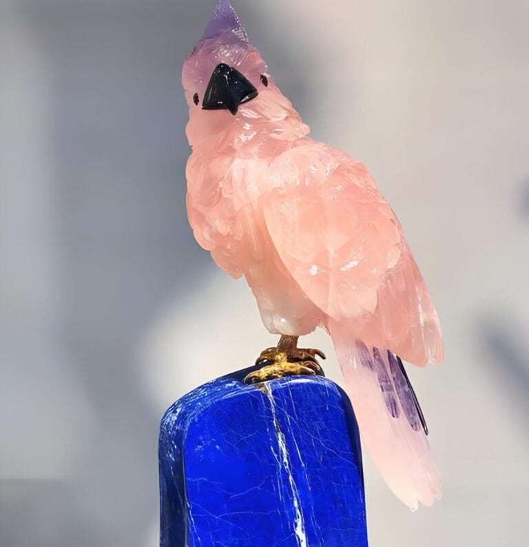 Chinese gemstone carving of a pink bird on a blue lapis lazuli base