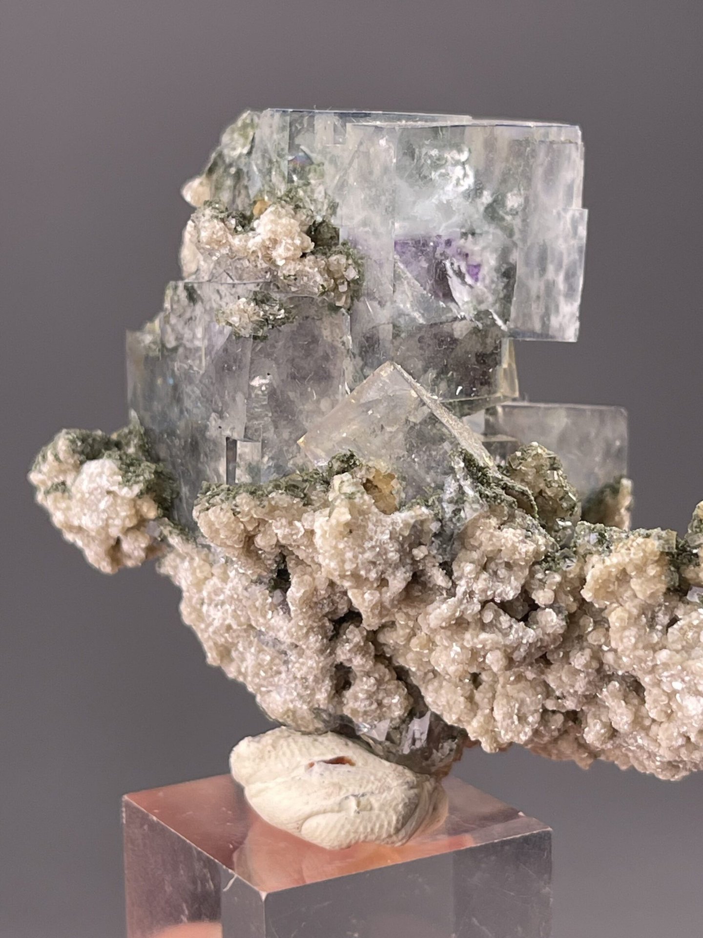 Green and purple fluorite crystal with calming energy.