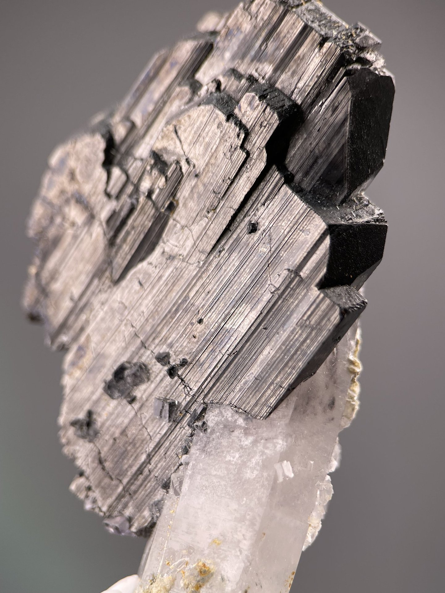 Angled view of Yaogangxian cassiterite highlighting striated faces