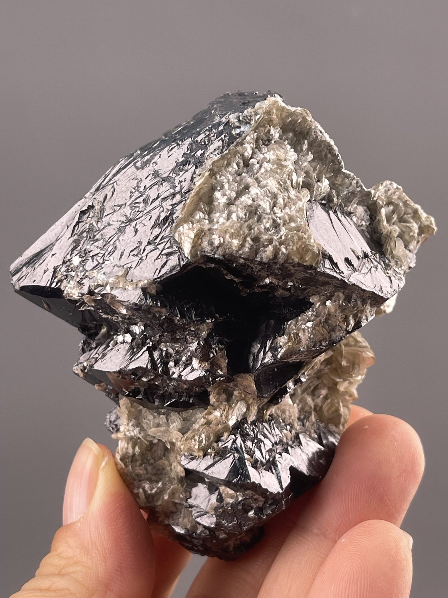 Cassiterite Crystal Specimen from Xuebaoding Mountain, China – angled view showing matrix
