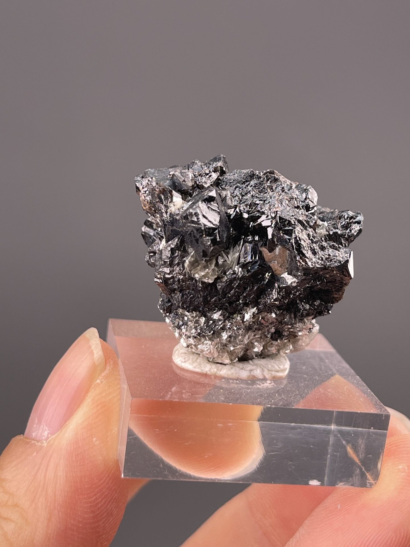Detail of cassiterite surface showing brilliant metallic sheen