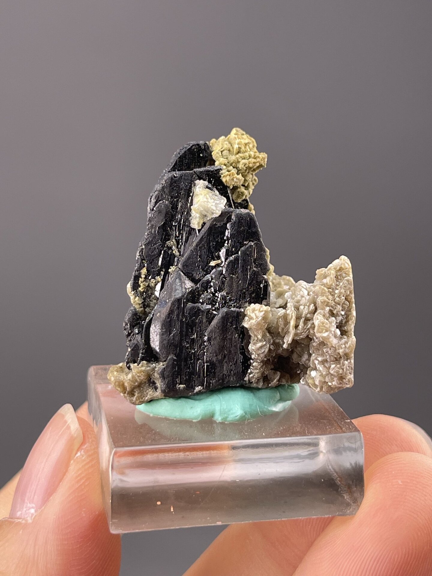 Close-up of cassiterite showing dark metallic surface