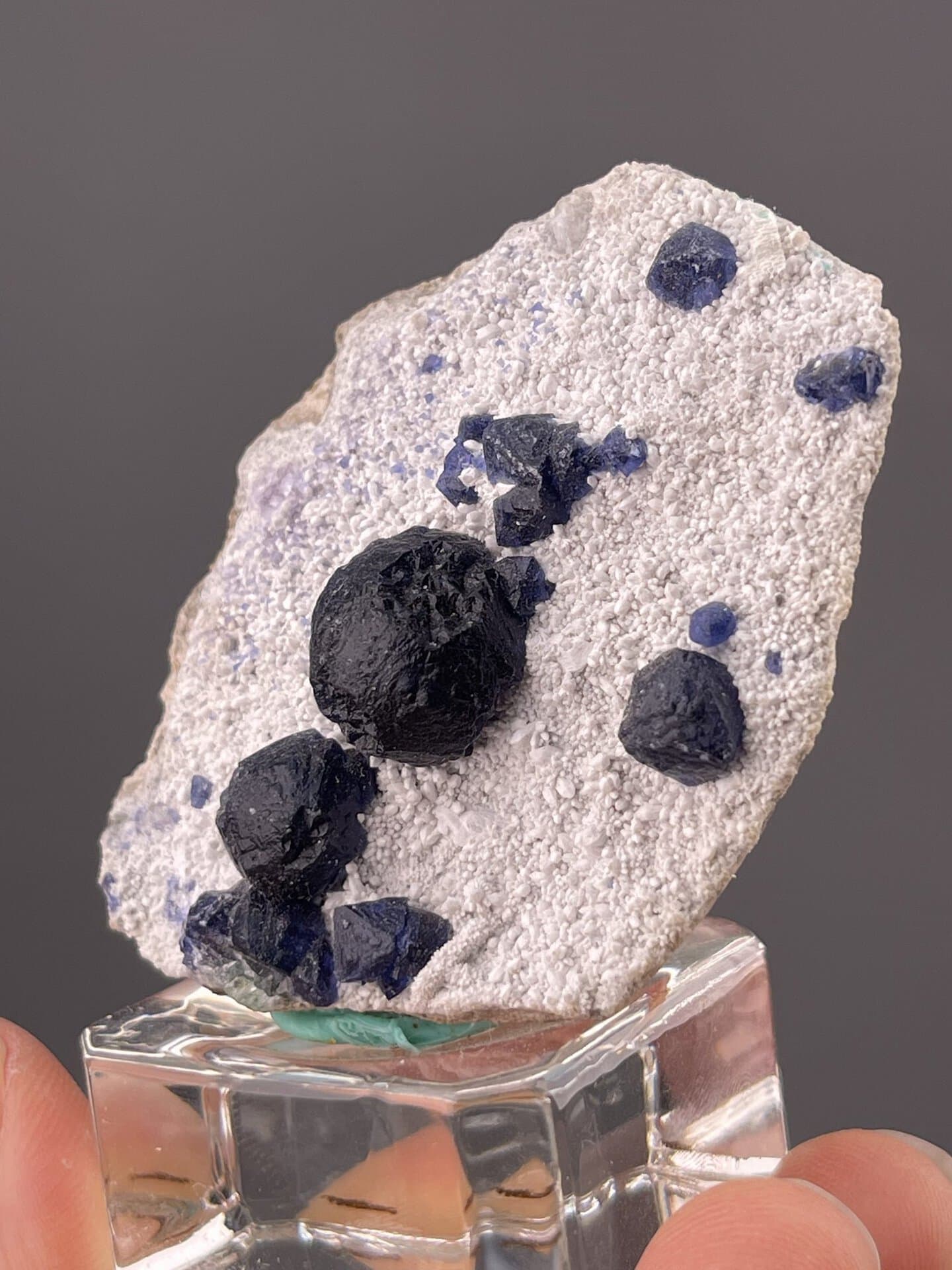 Close-up of blue fluorite showing vitreous luster on quartz base