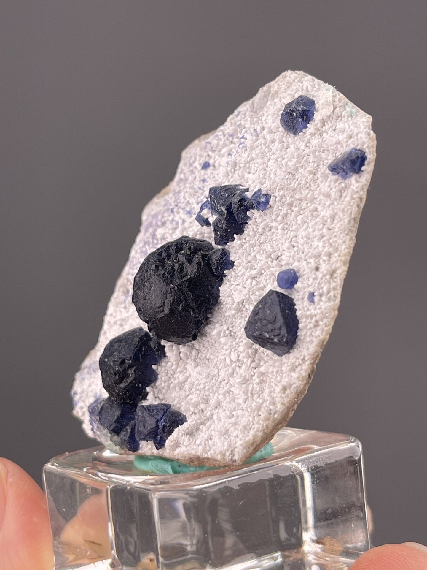 Side view of fluorite specimen showing botryoidal surface on matrix