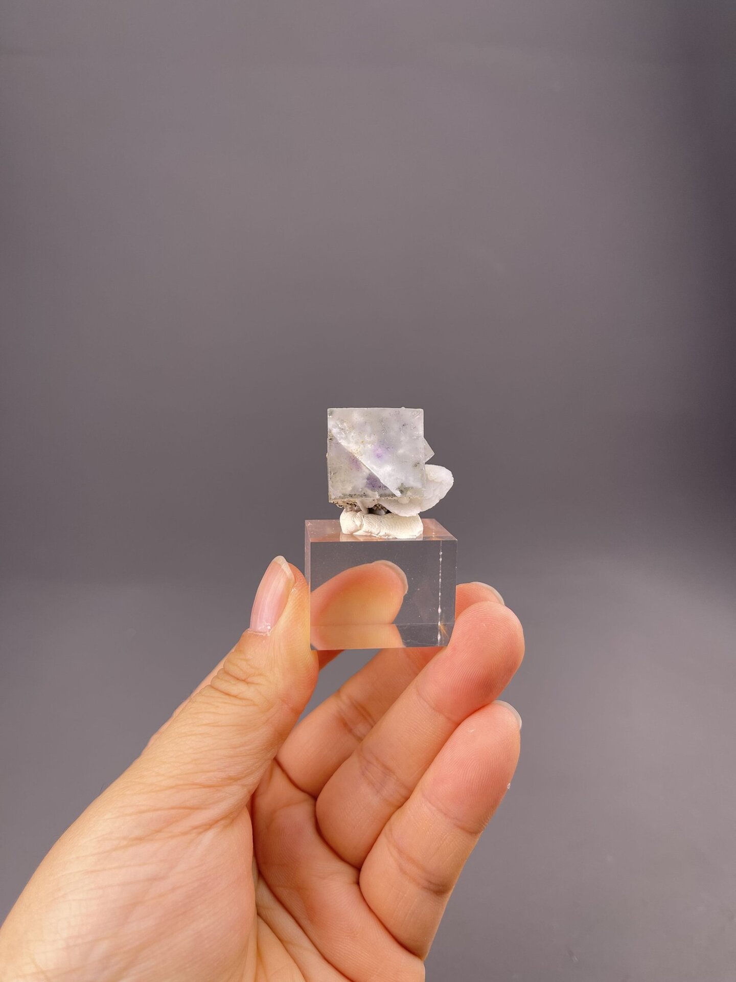 Water-clear fluorite cube showing exceptional transparency, 0.5 g