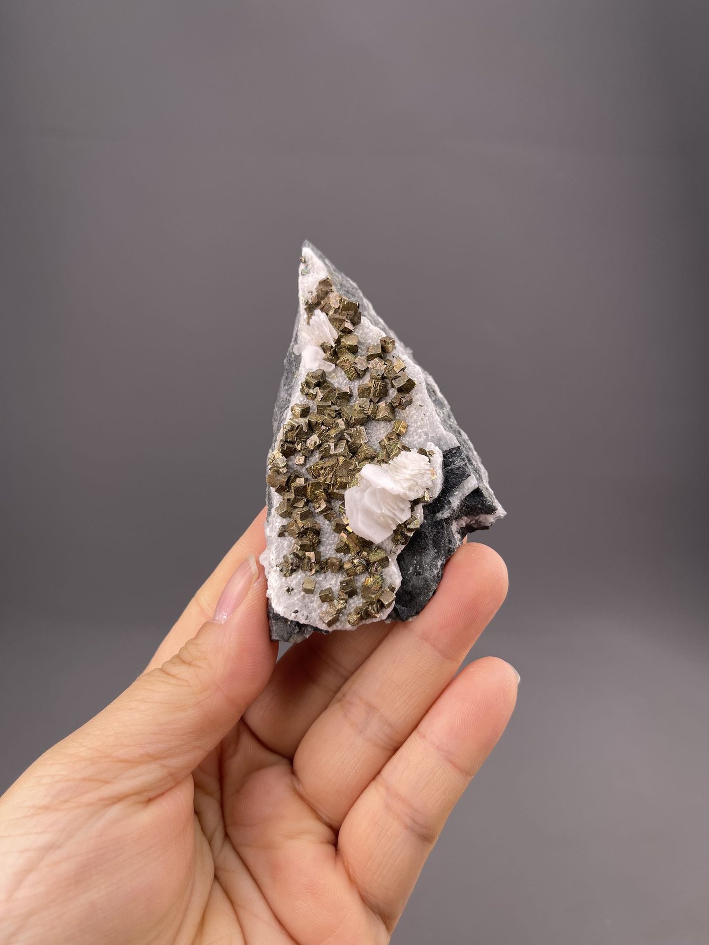 Golden pyrite crystals on calcite matrix, Tonglushan Mine, Daye, Hubei