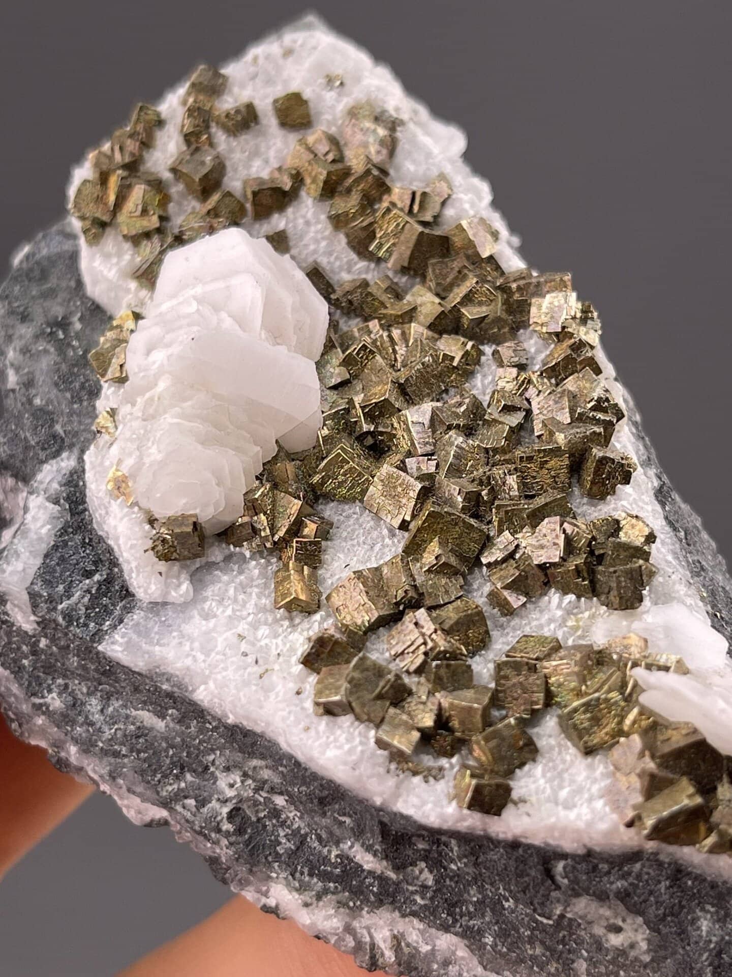 Shimmering pyrite cubes on white calcite, Tonglushan Mine, 2.8 g