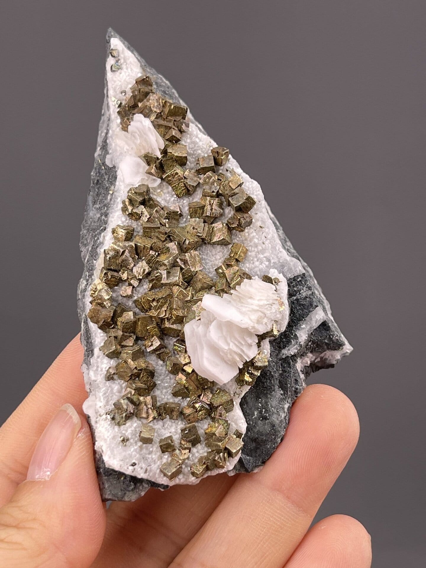 Front view of pyrite on calcite, 35×7×22 mm, Tonglushan Mine
