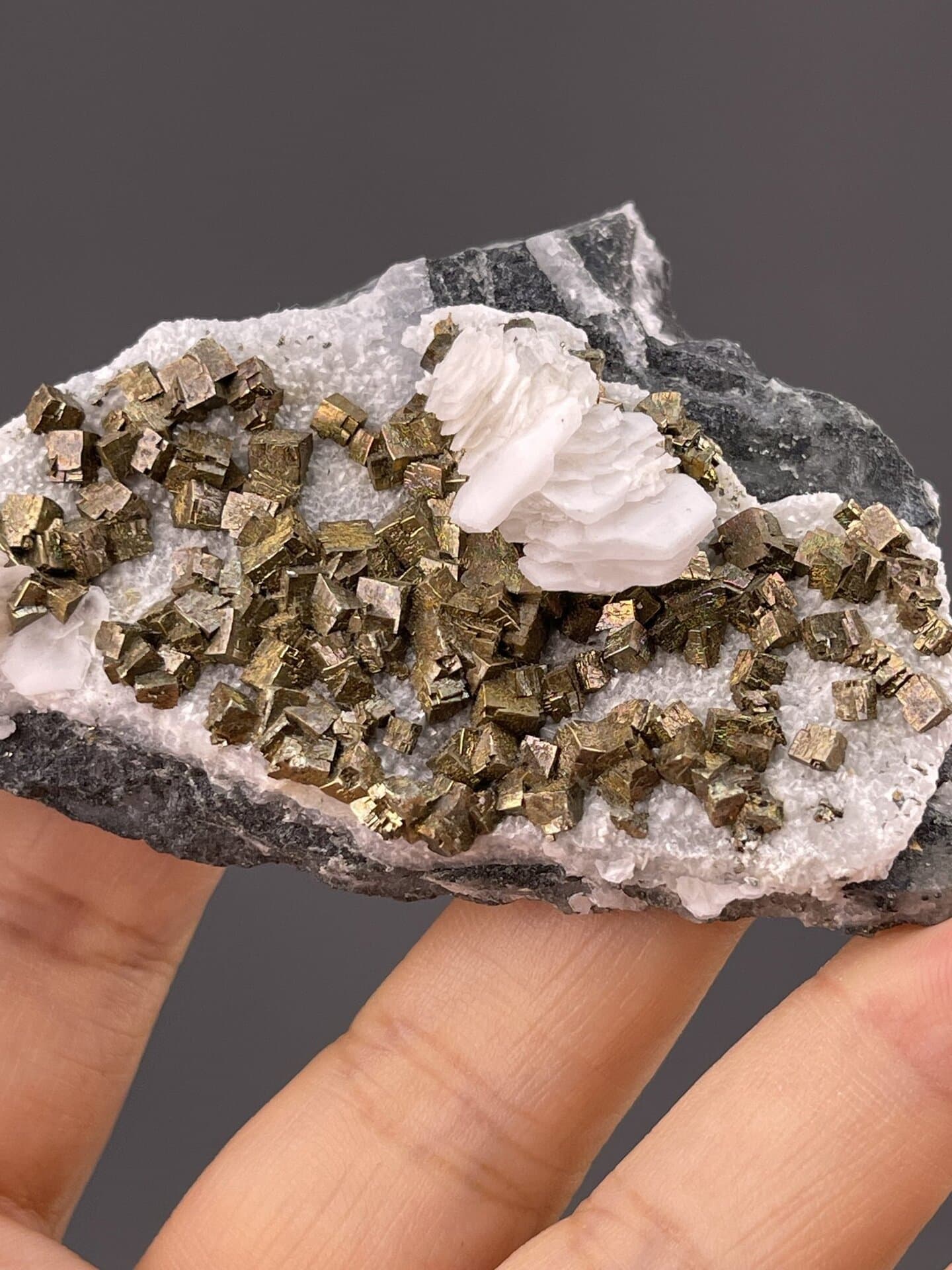 FeS₂ isometric pyrite, Mohs 6–6.5, on calcite, Tonglushan Mine