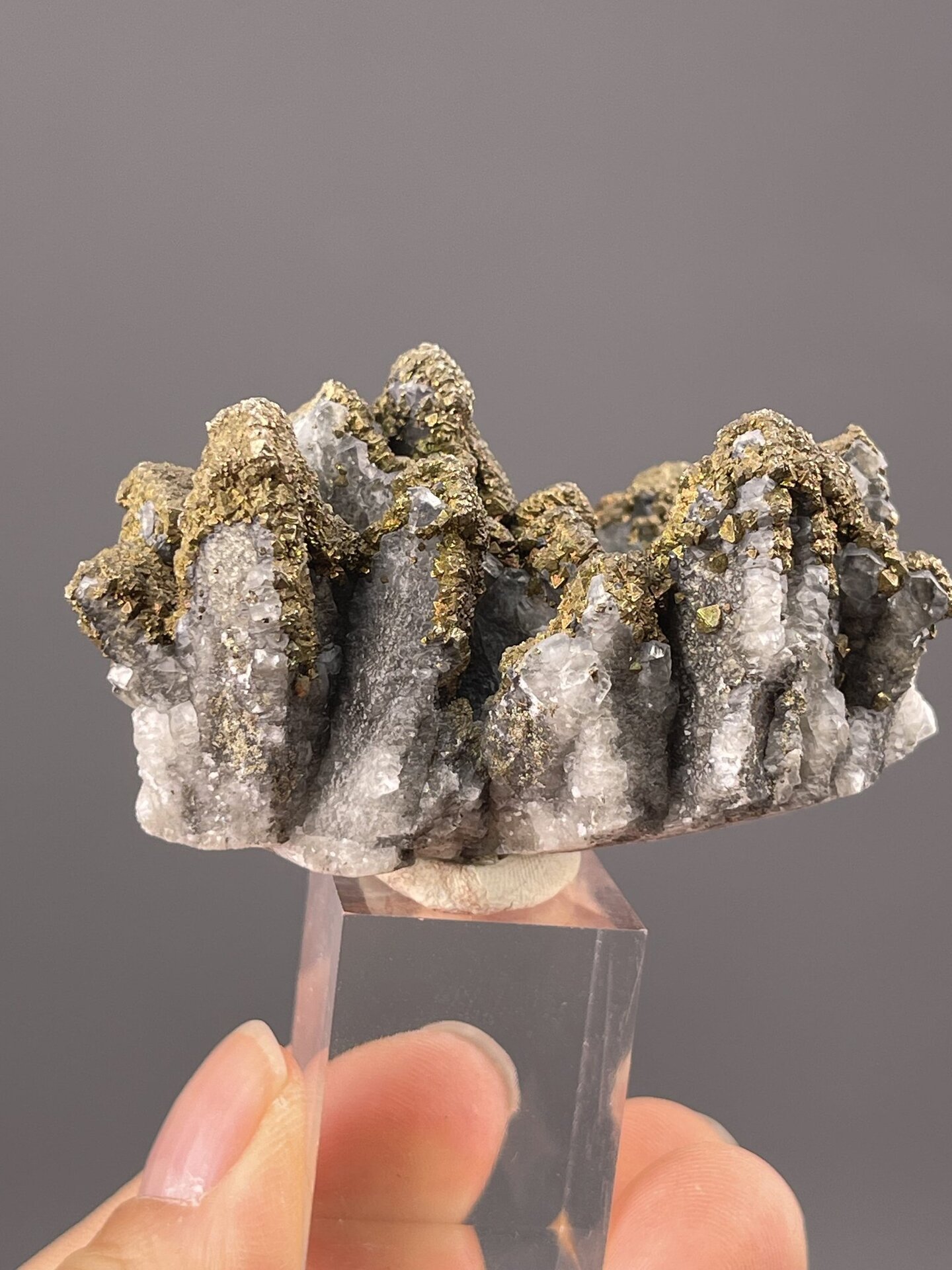 Side view of pyrite showing druzy habit on crystal form