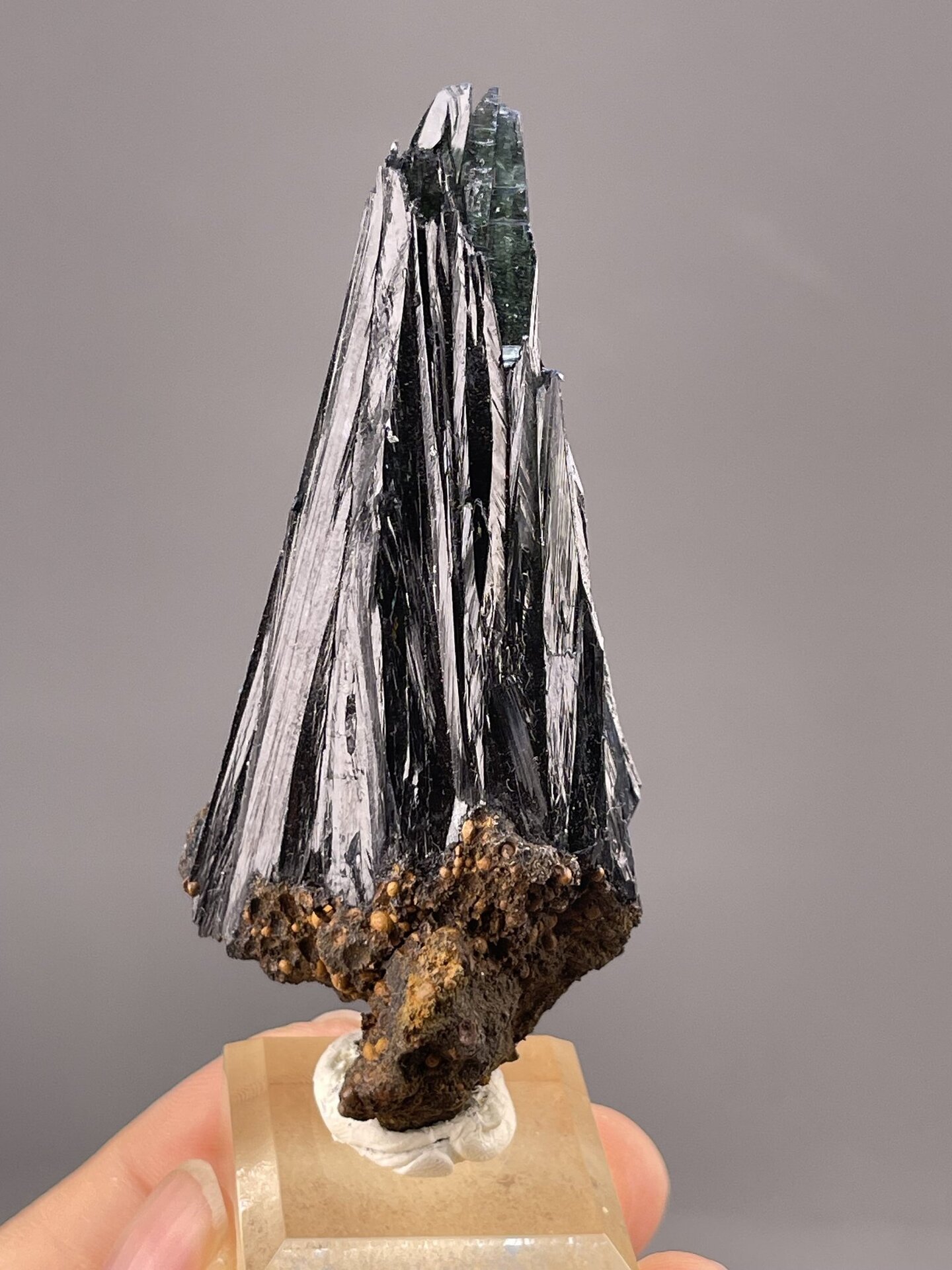 Close-up of hematite crystals showing iridescent metallic surface