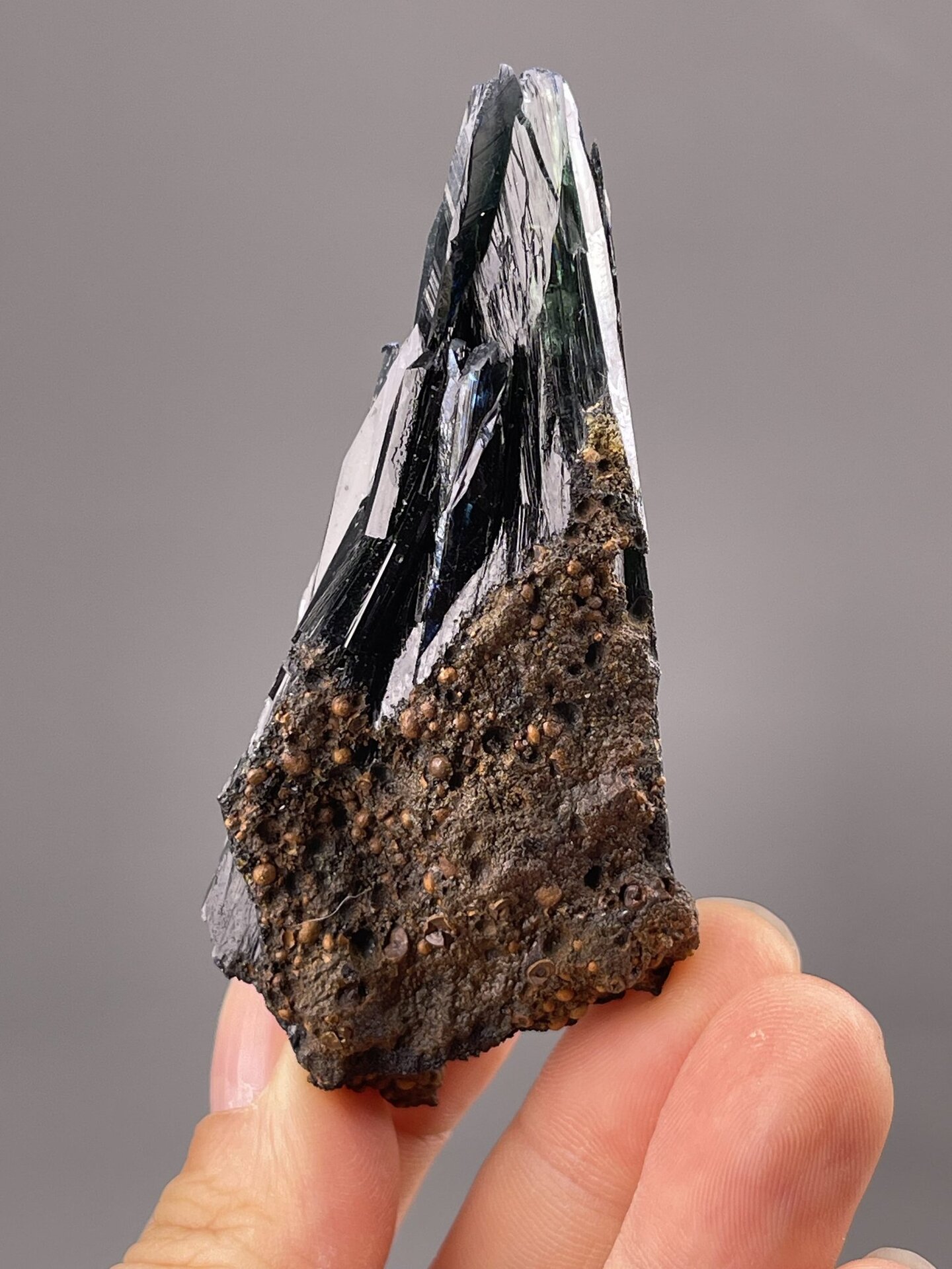 Angled view of Minas Gerais hematite showing colour play on faces