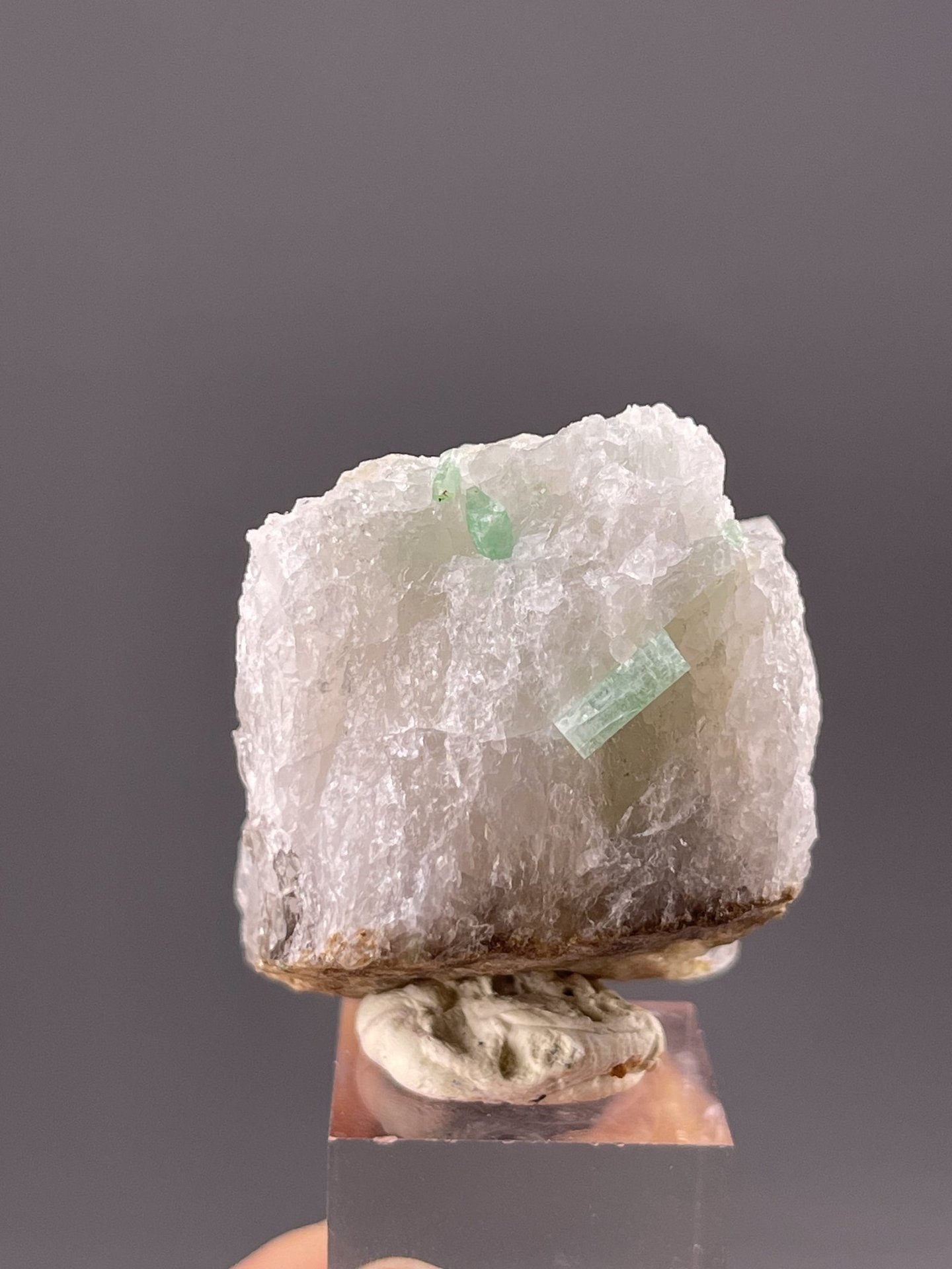 Angled view of Dachang emerald highlighting translucent green body