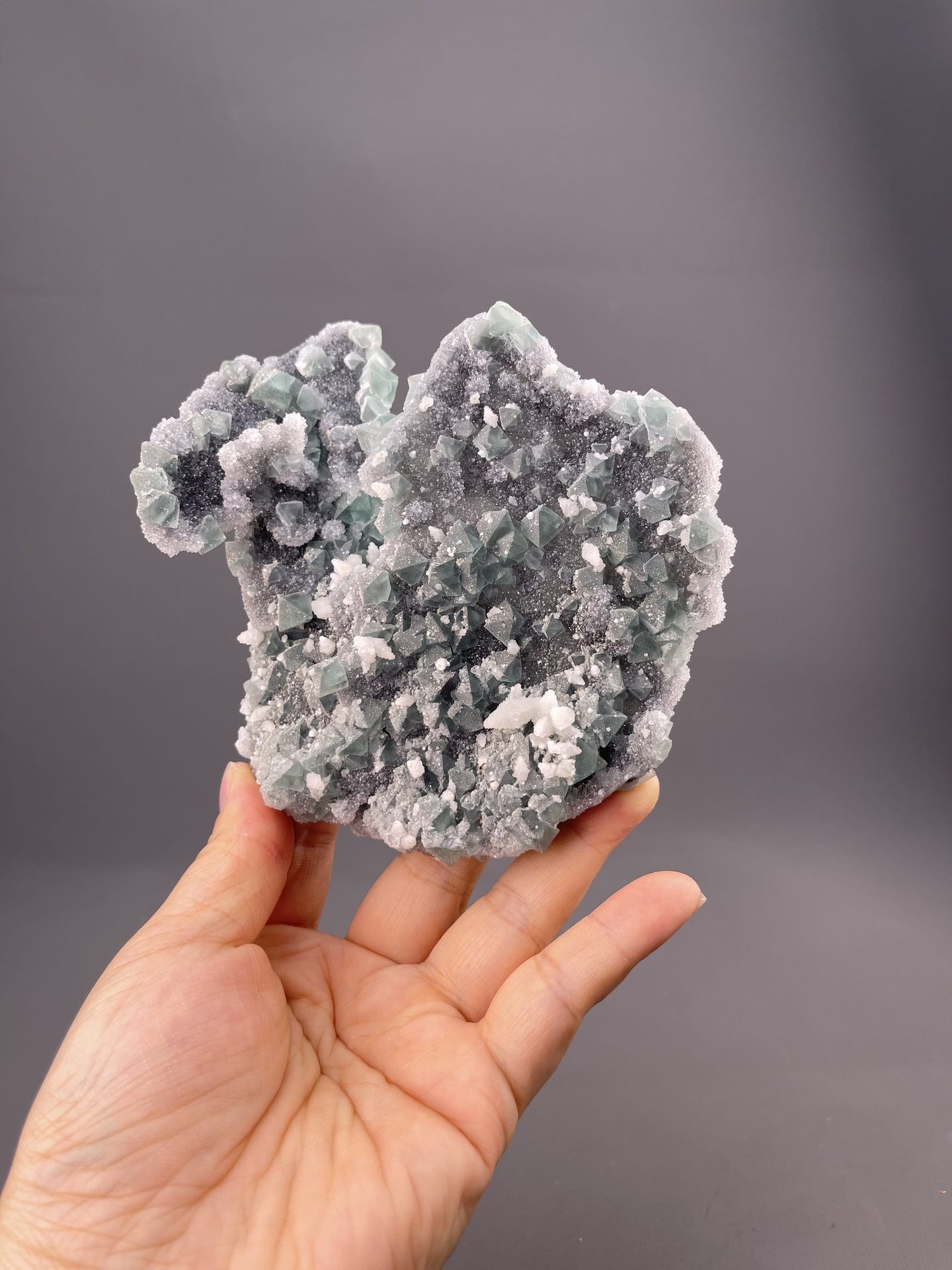 Close-up of green fluorite crystals showing colour banding