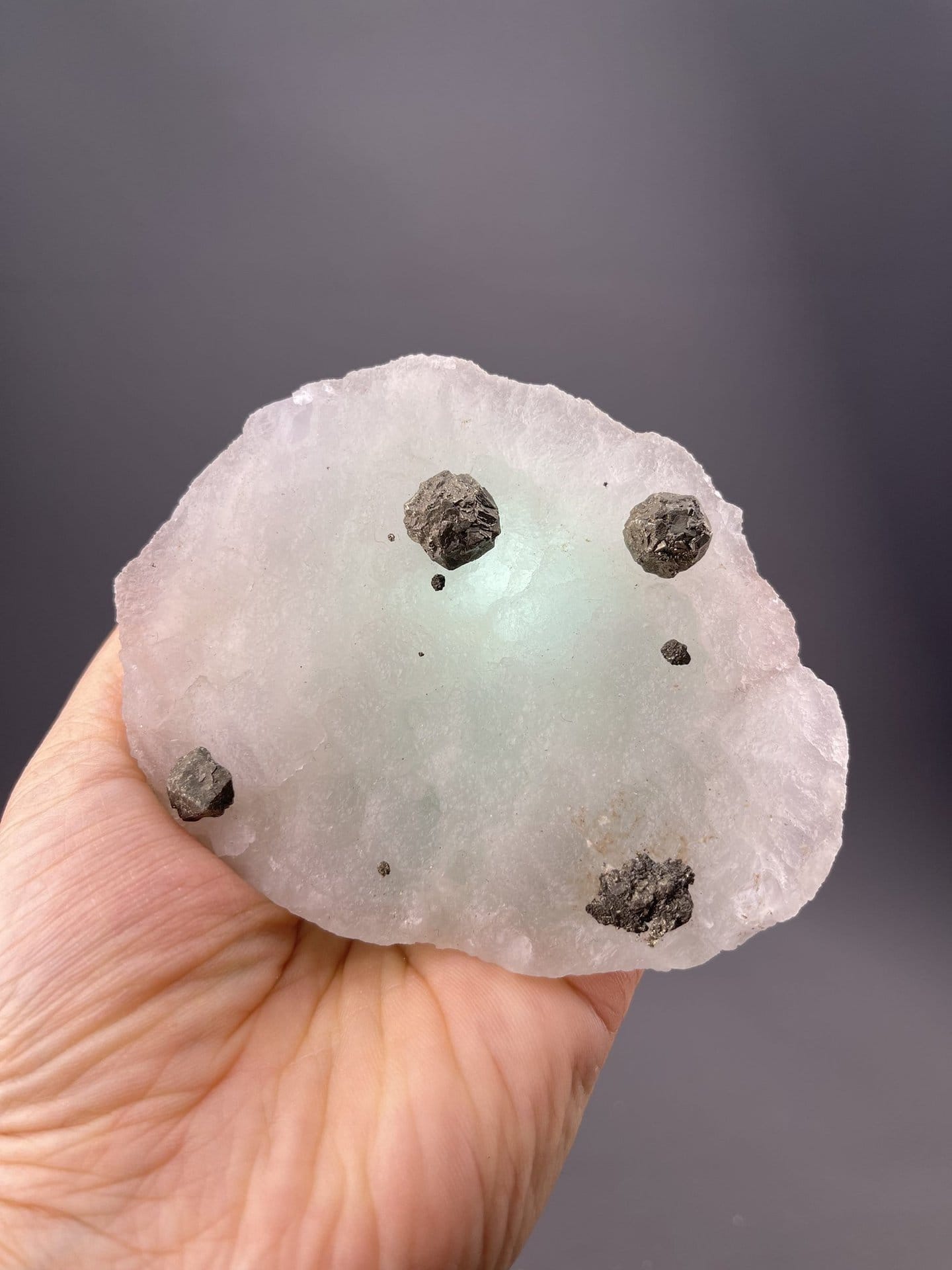 Green fluorite cluster on black magnetite matrix, Inner Mongolia, China