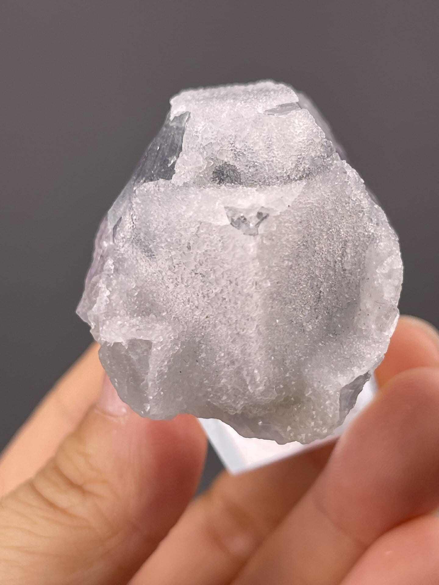 Detail of fluorite surface showing glassy luster and green tone