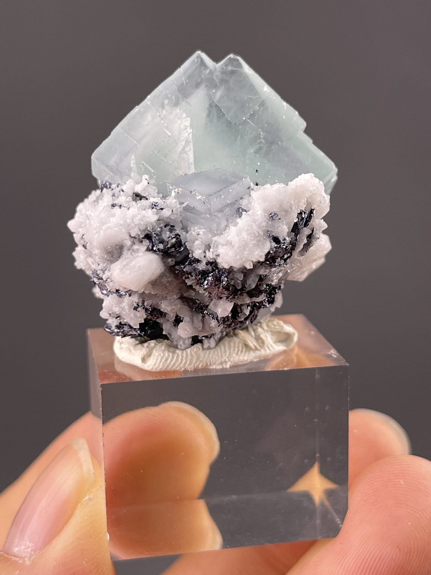Close-up of quartz faces showing frosted green cubic appearance