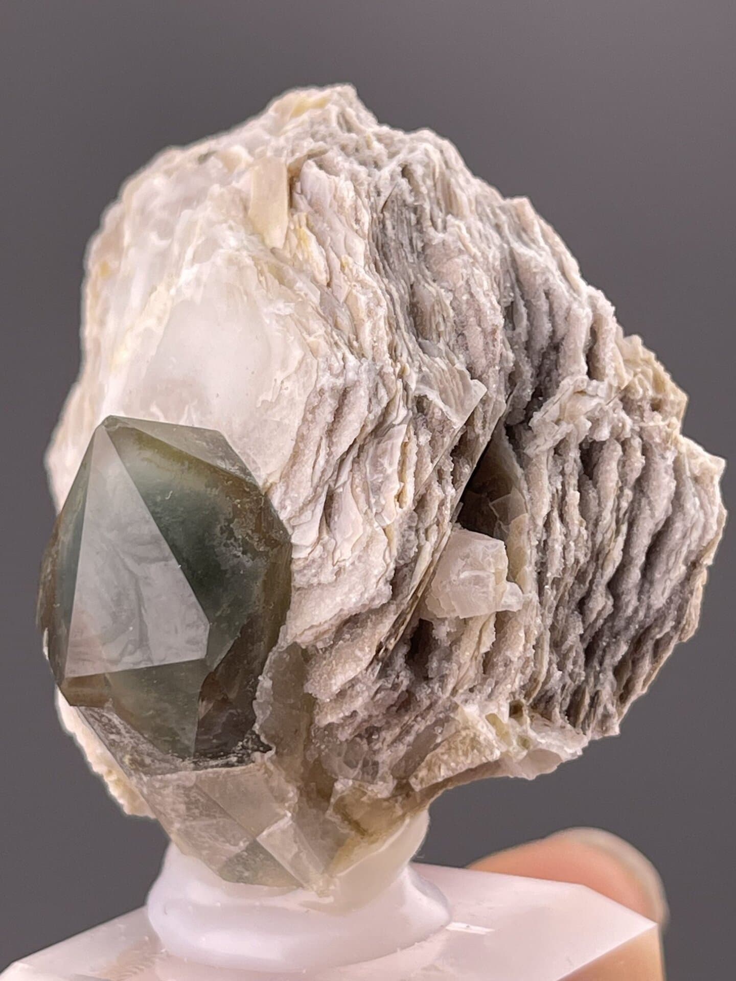 Detail of quartz surface showing vitreous luster and green hue