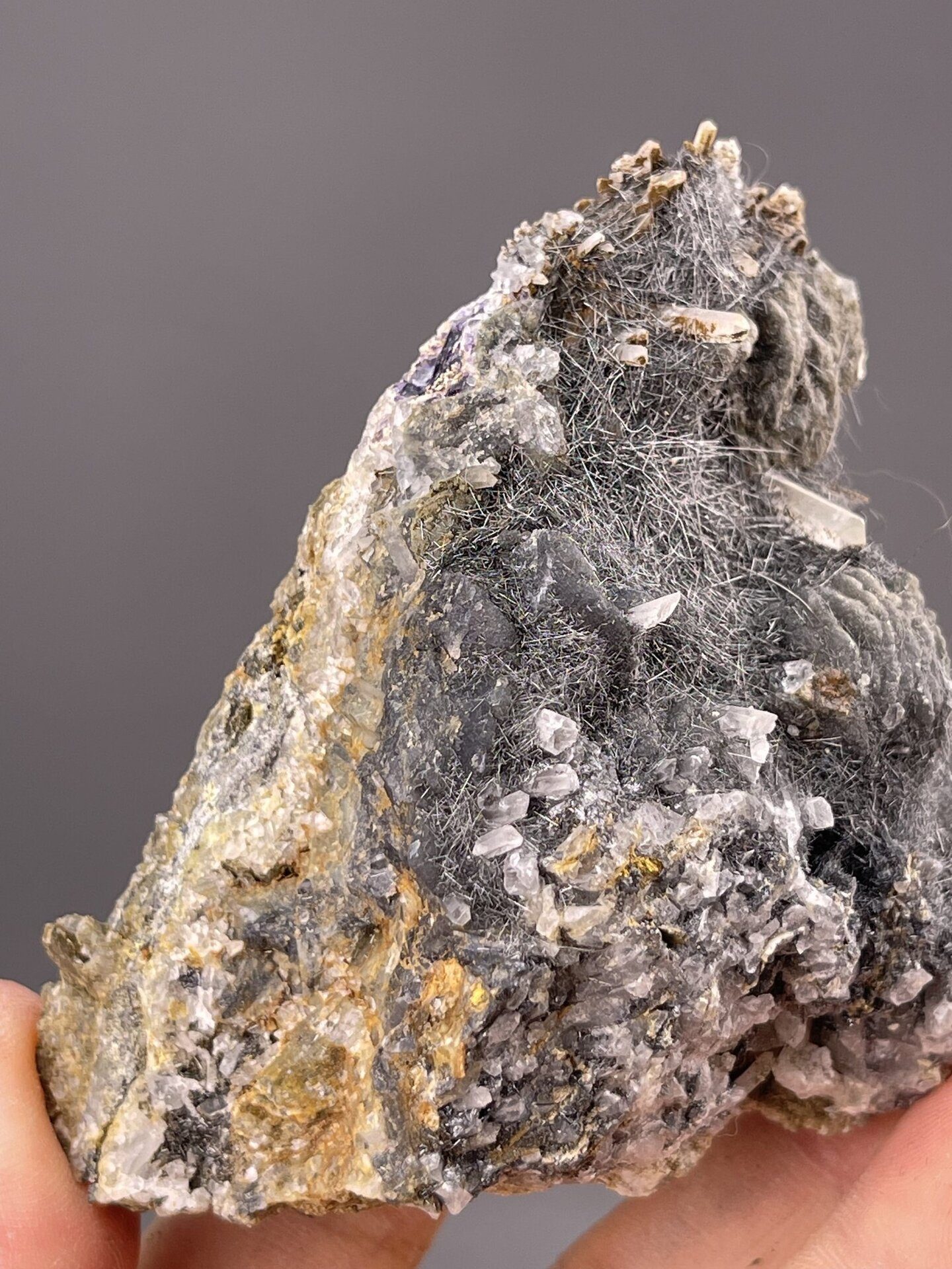 Detail of bismuthinite surface showing brilliant metallic luster