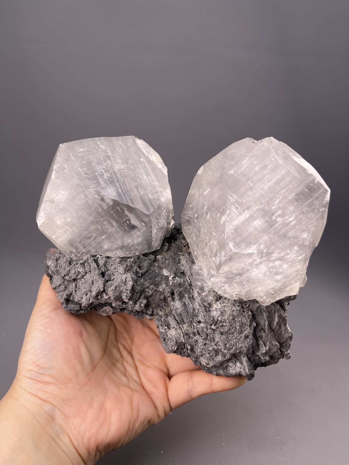 Side view of calcite cluster on matrix, 71×43×55 mm