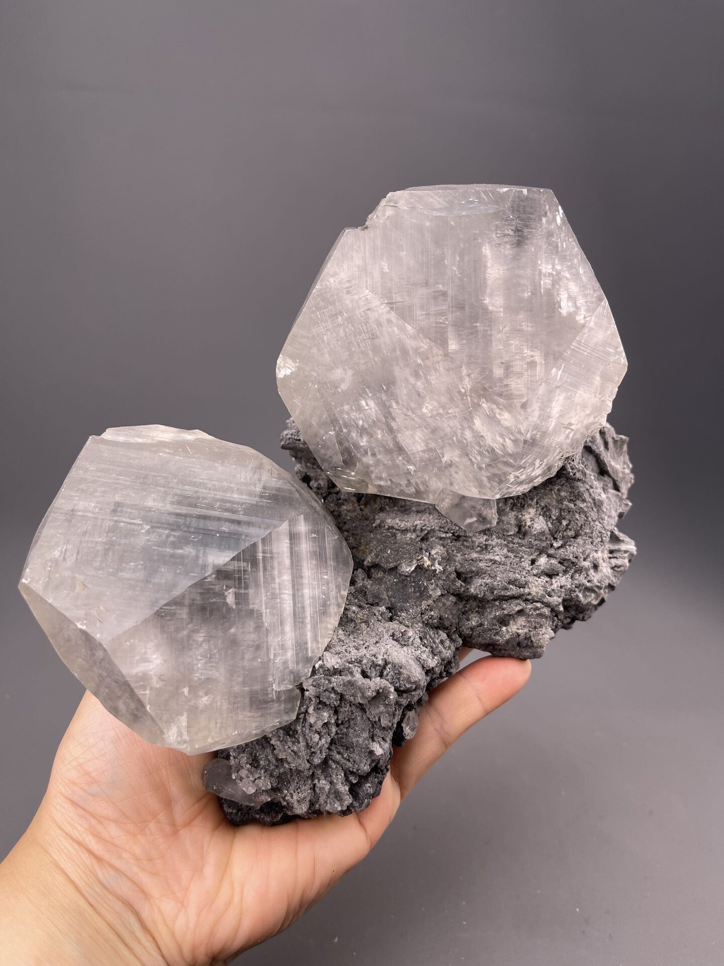 Close-up of grey calcite crystal faces showing vitreous luster