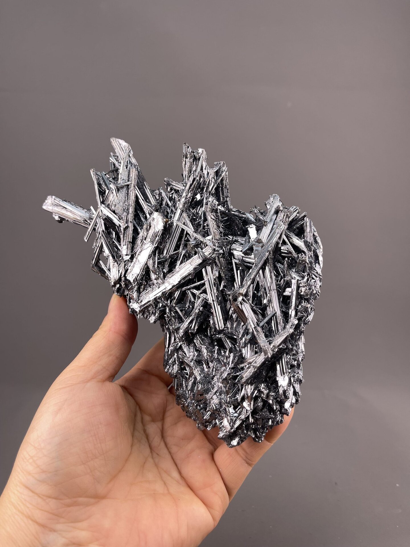 Stibnite Crystal Formation from Hunan, China – angled view showing matrix