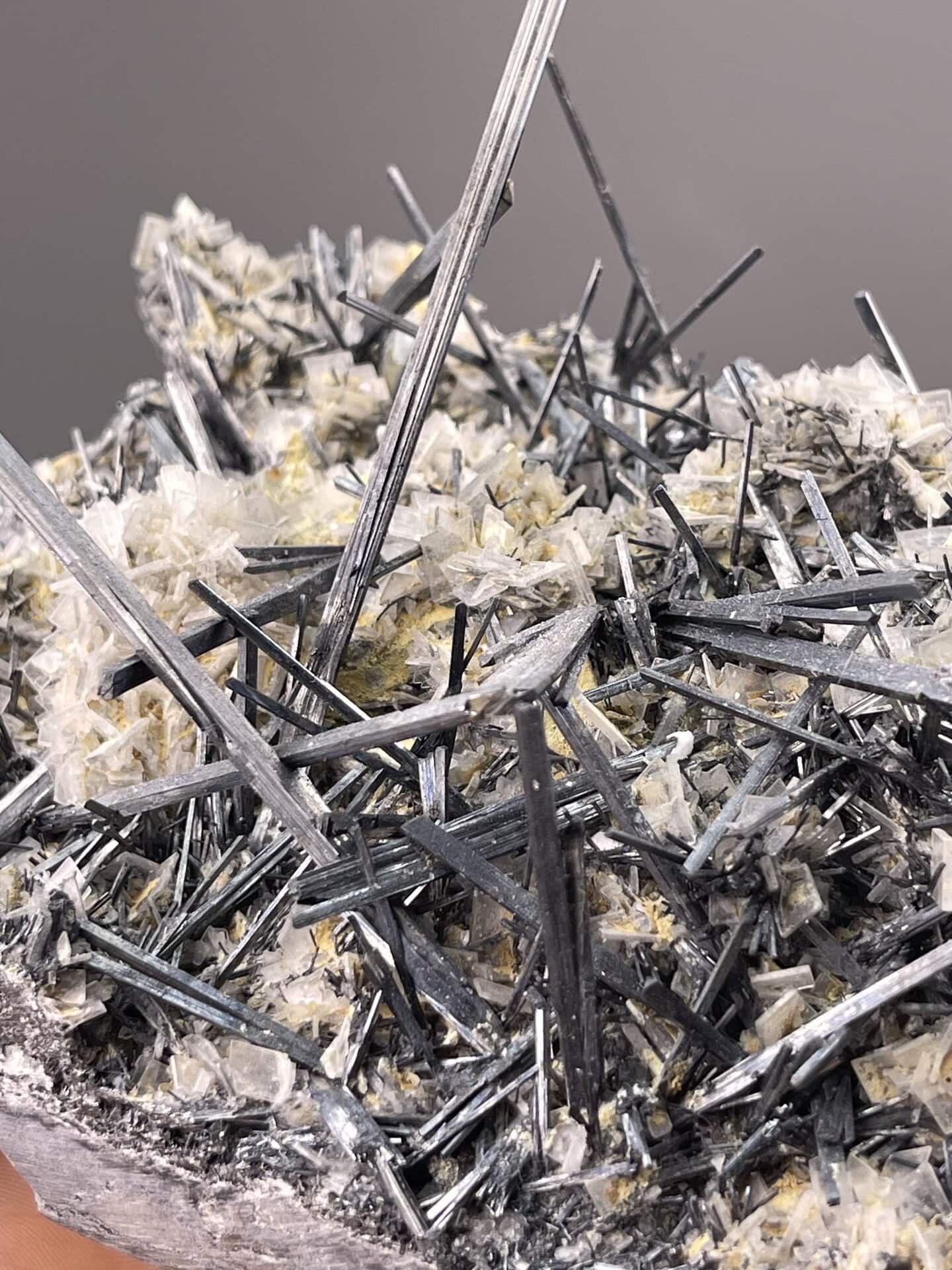 Stibnite Crystals from Hunan, China – angled view showing matrix