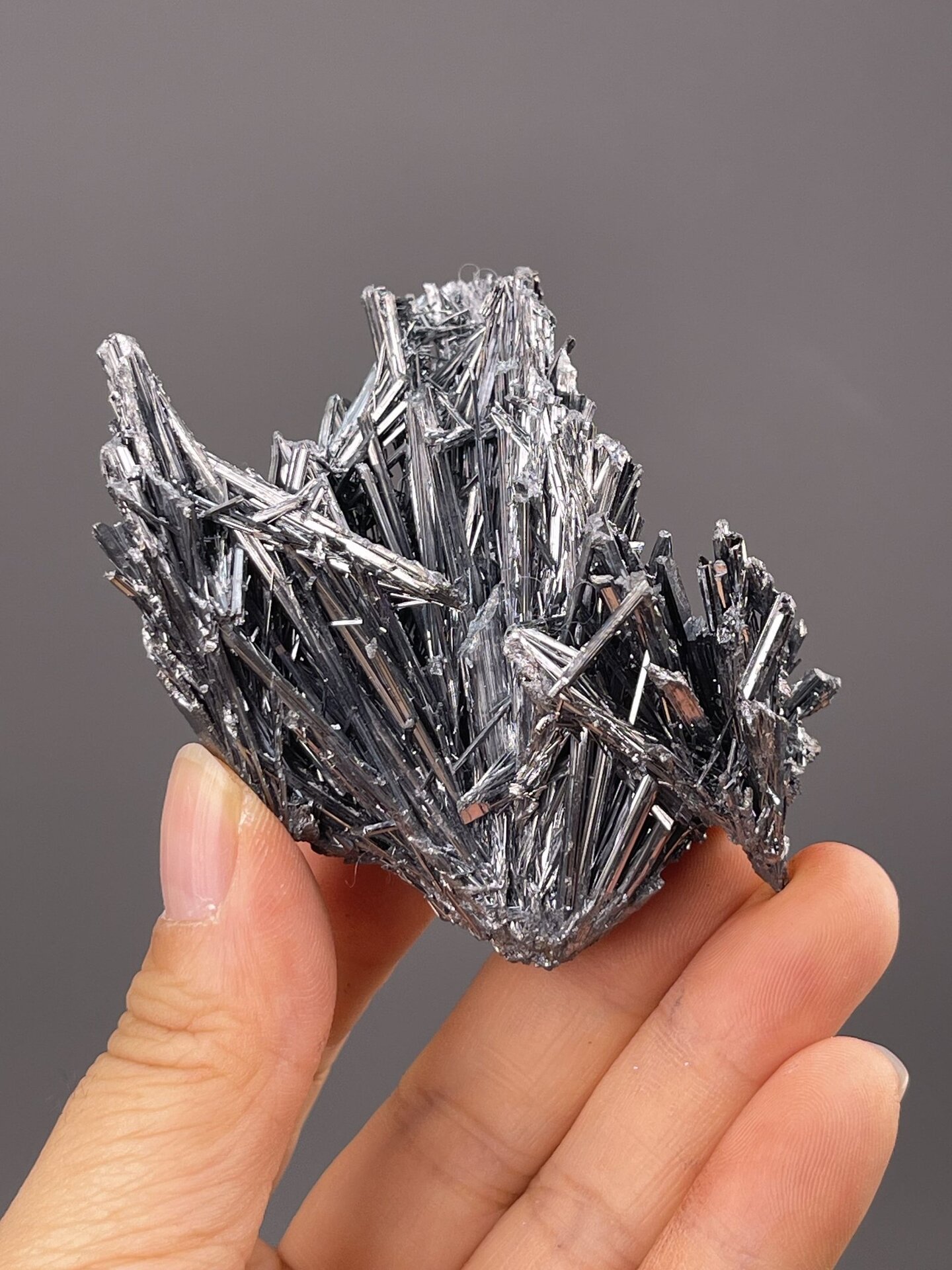 Front view of stibnite cluster, 22×17×26 mm, Lengshuijiang Mine