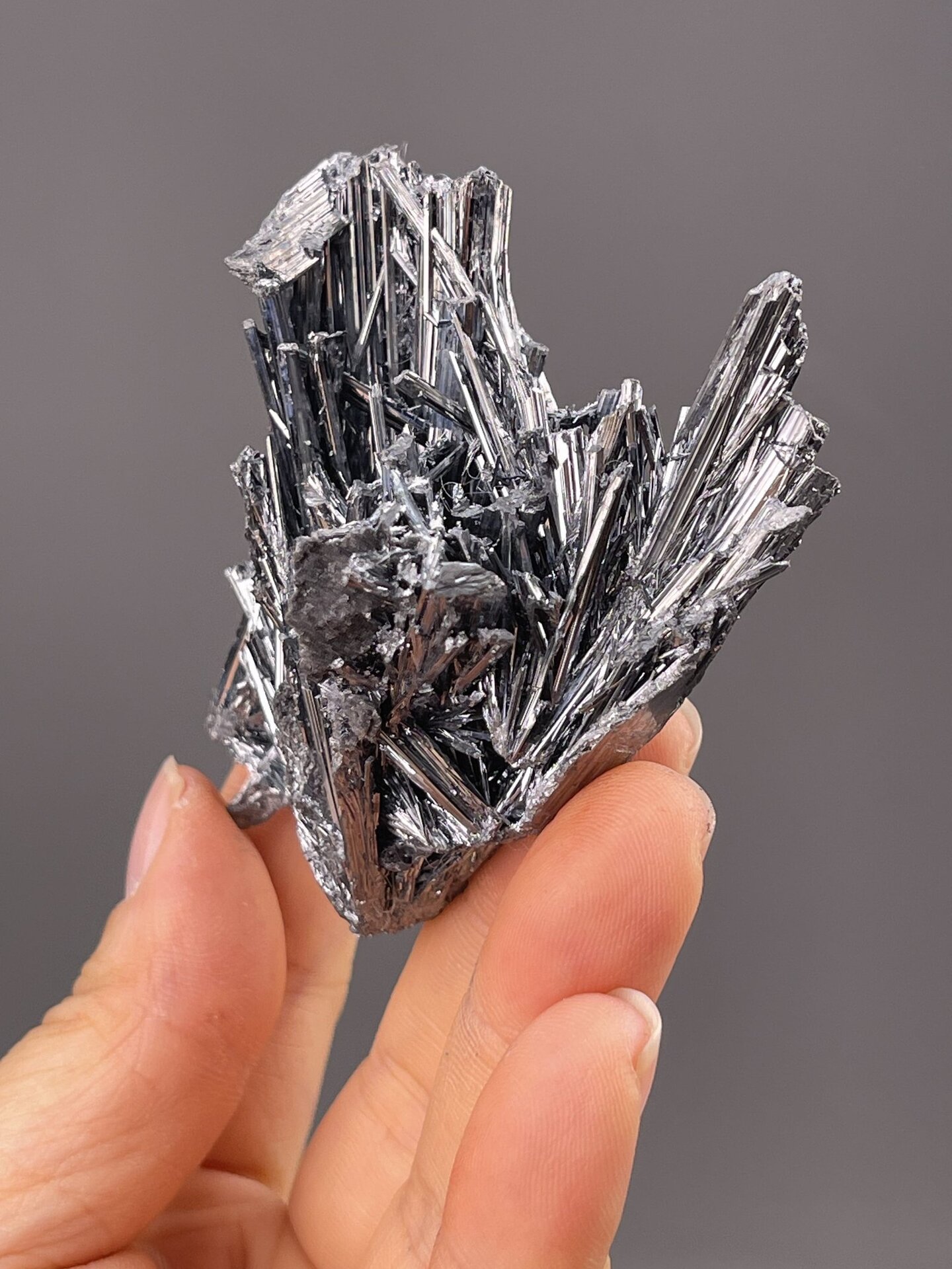 Detail of stibnite surface showing brilliant metallic luster