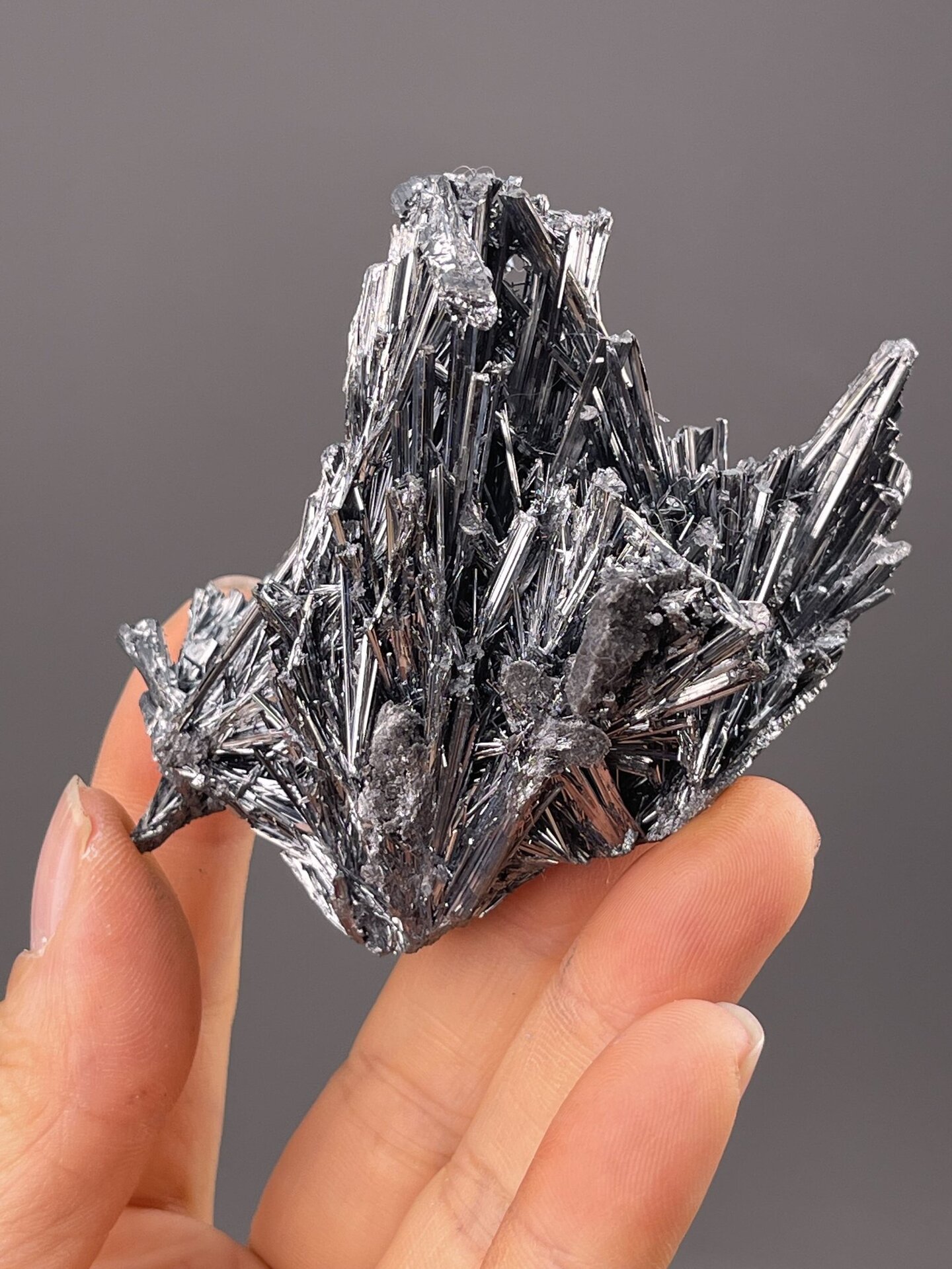 Angled view of Lengshuijiang stibnite highlighting needle habit