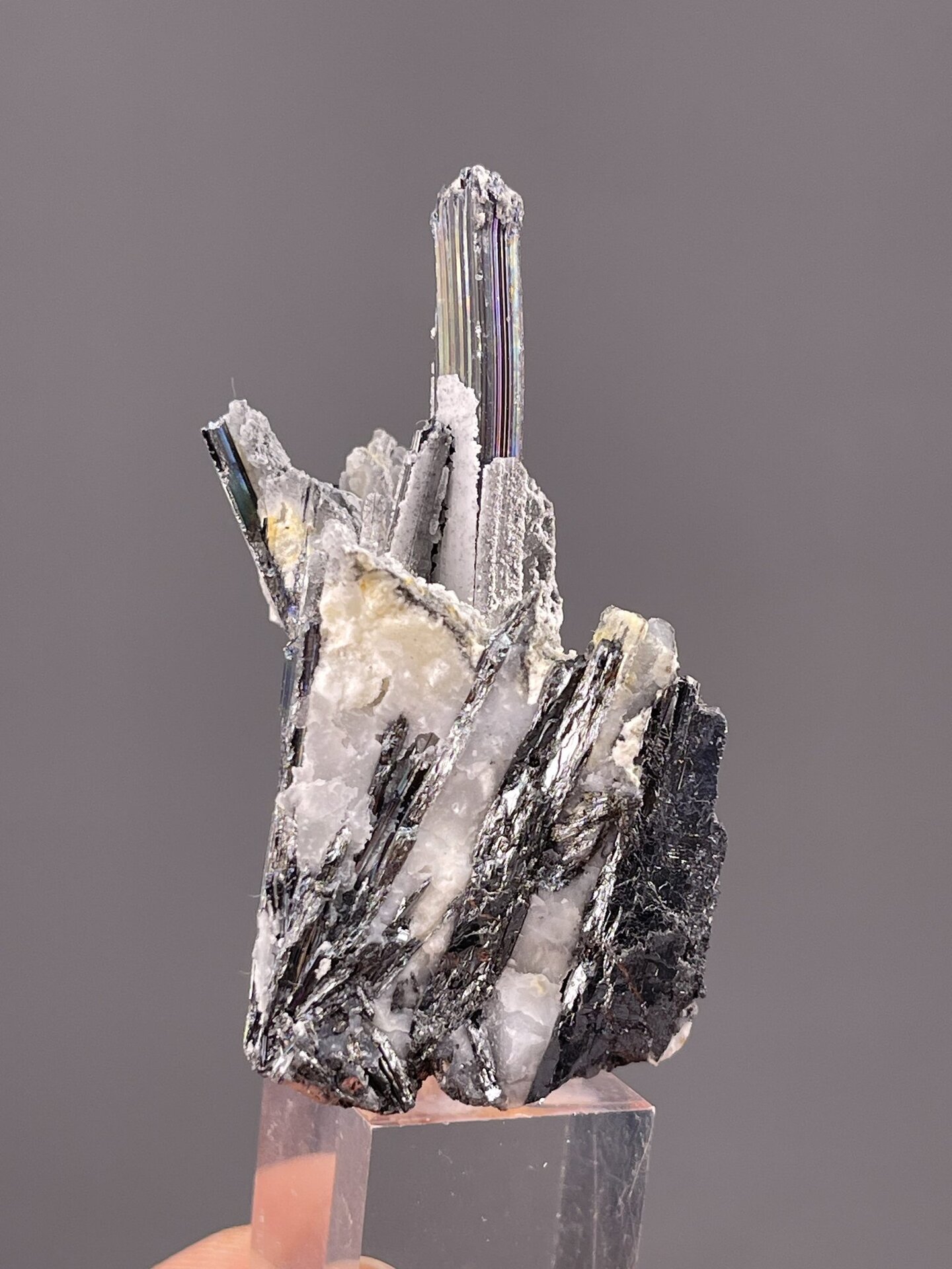 Detail of stibnite showing metallic sheen on gray surface