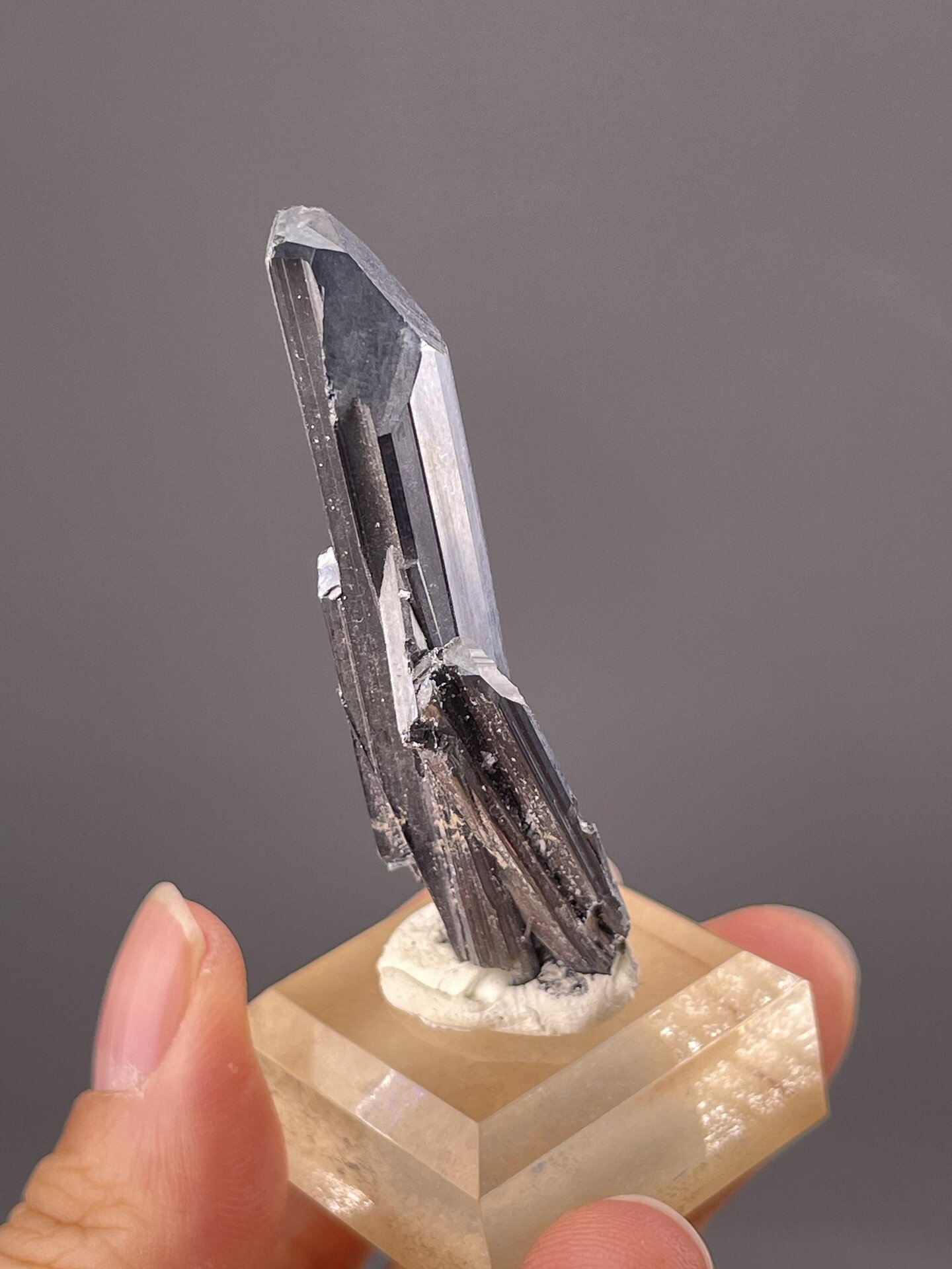 Detail of stibnite crystal surface showing metallic luster