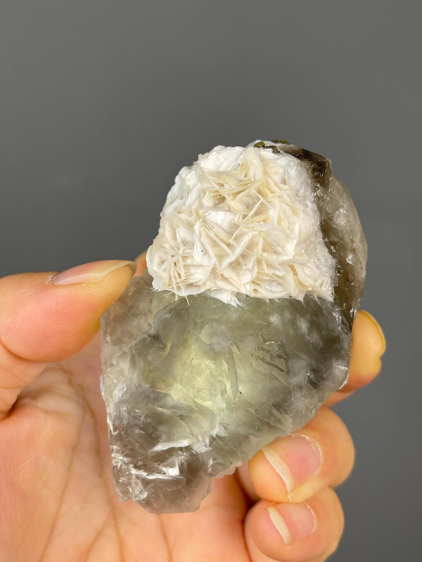 Close-up of dark green fluorite cubic crystals with calcite