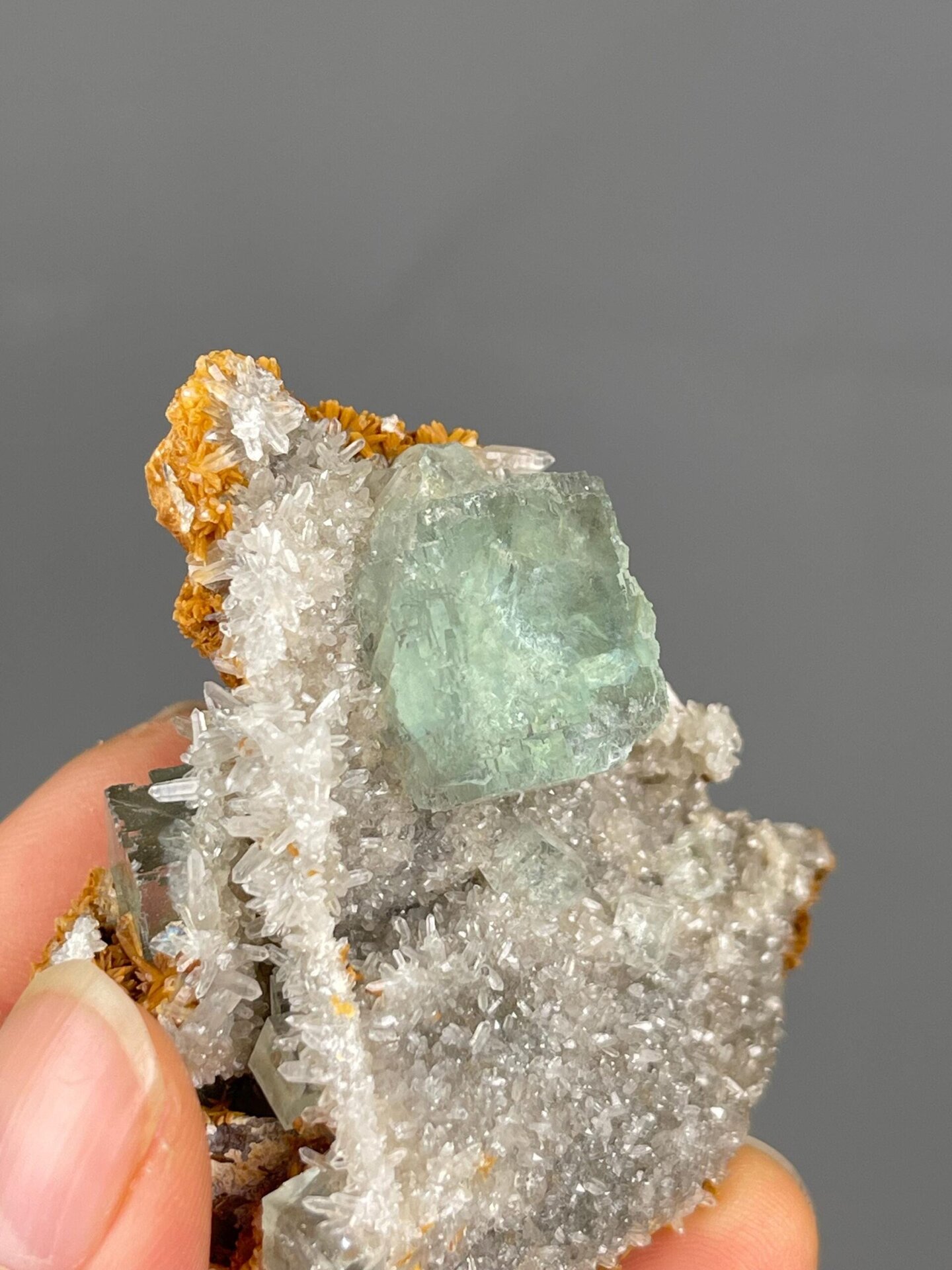 White calcite contrasting with green fluorite