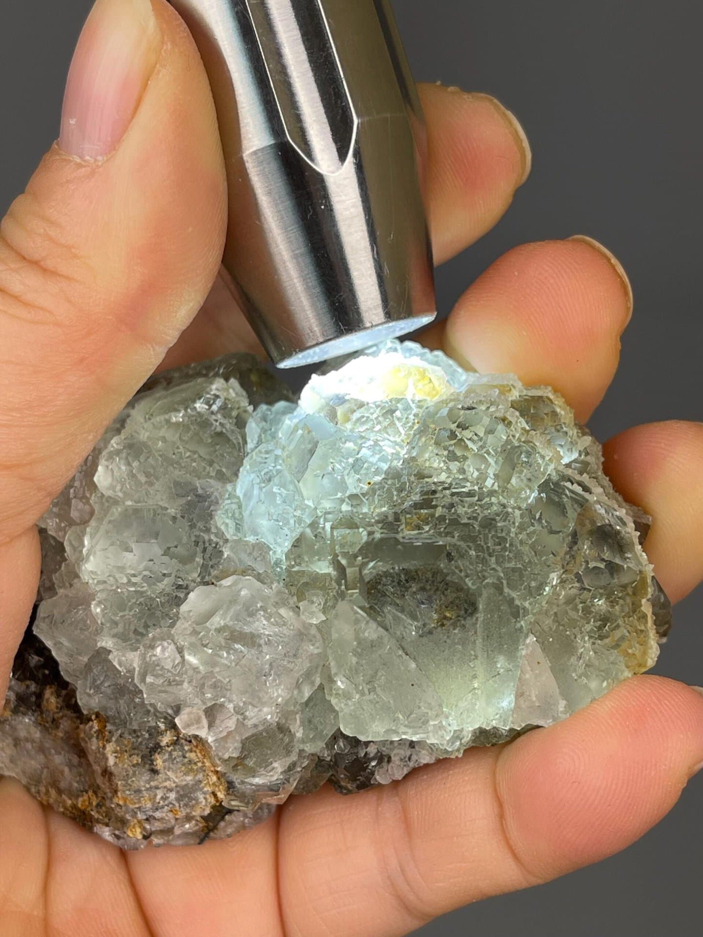 Scale reference of green fluorite cube on matrix
