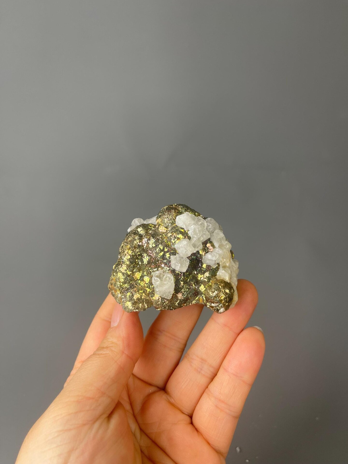 Front view of iridescent chalcopyrite and calcite cluster