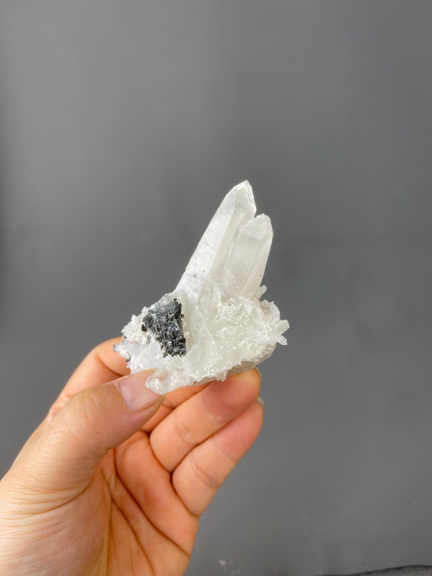 Front view of clear quartz cluster with pyrite from Yaogangxian
