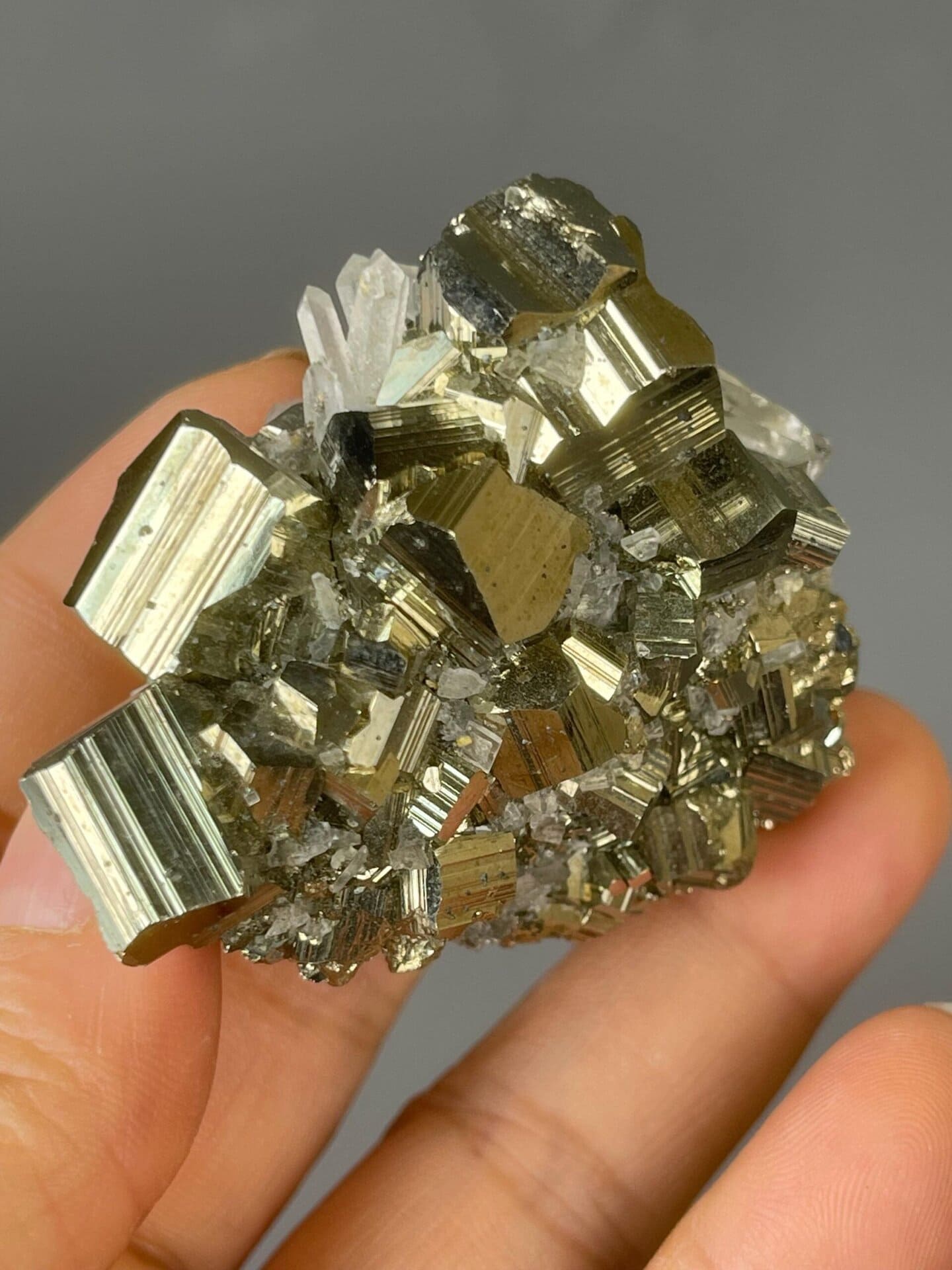 Metallic gold pyrite surfaces catching studio lighting