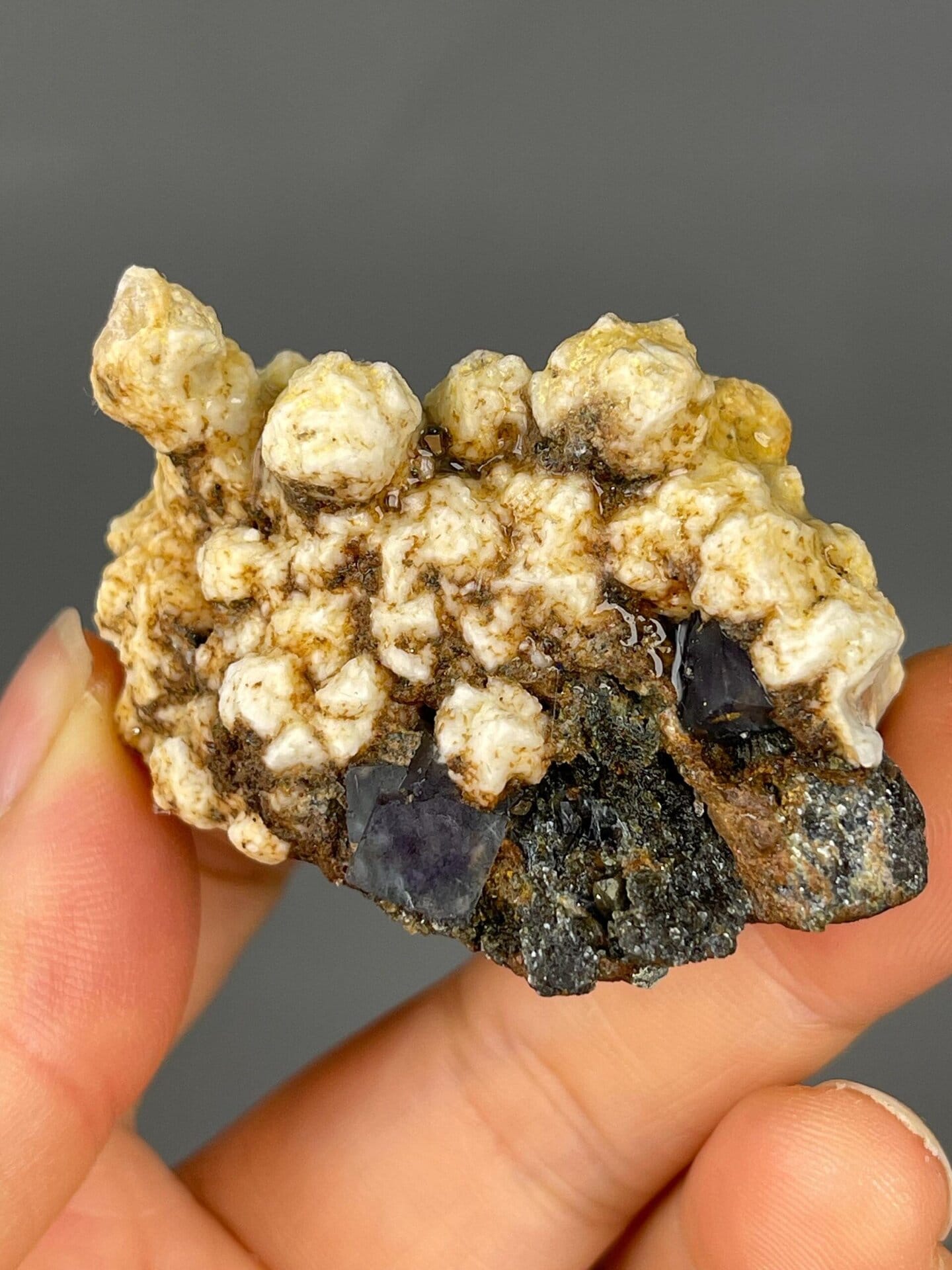 Small pyrite crystals alongside fluorite and dolomite