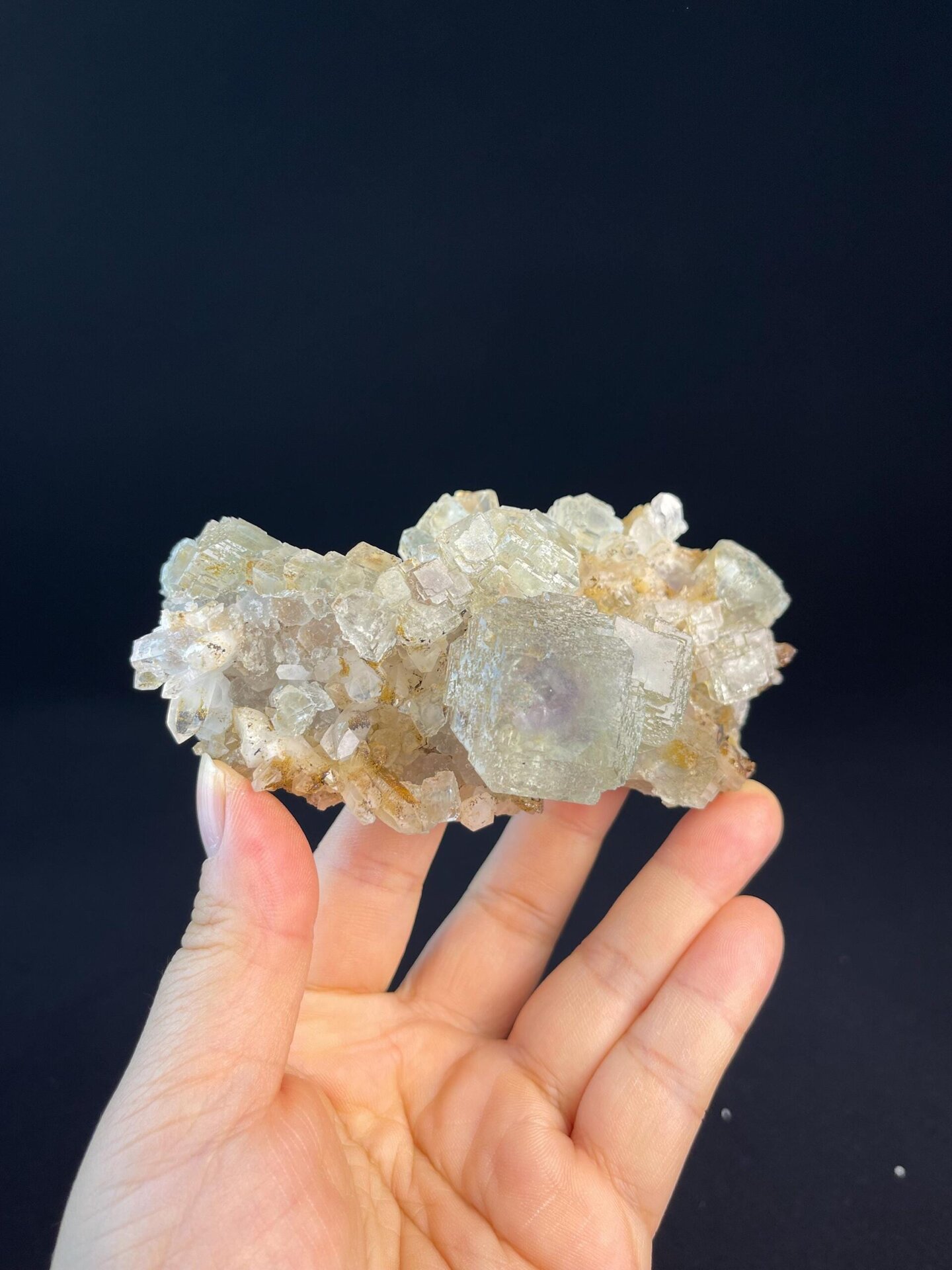 Front view of step-cut purple fluorite cluster from Xianghualing