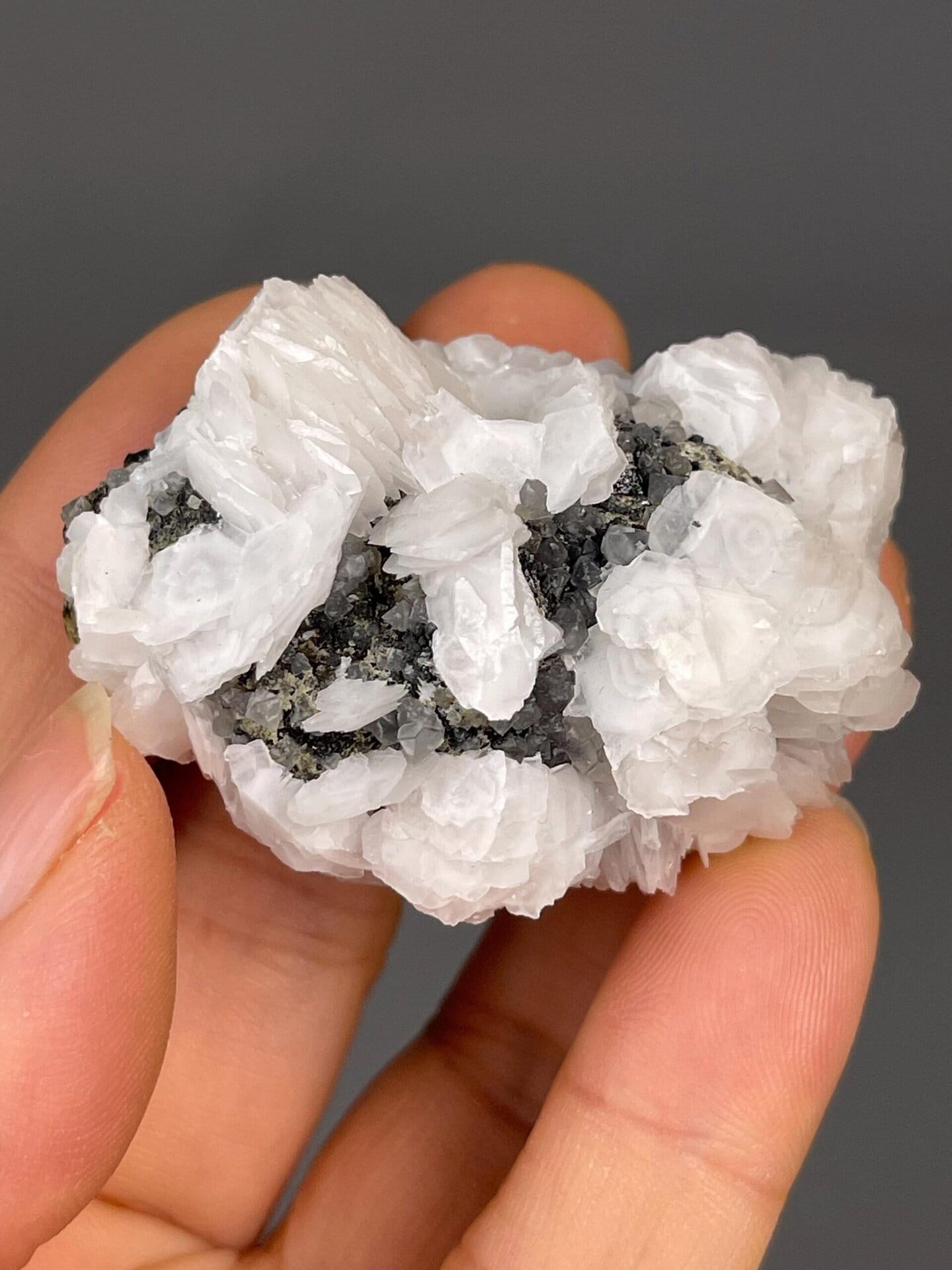 Vitreous luster on pink calcite crystal faces