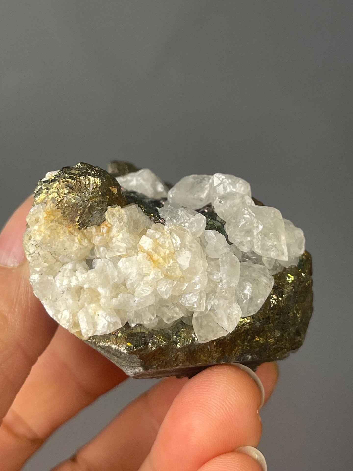 Calcite crystals alongside iridescent chalcopyrite