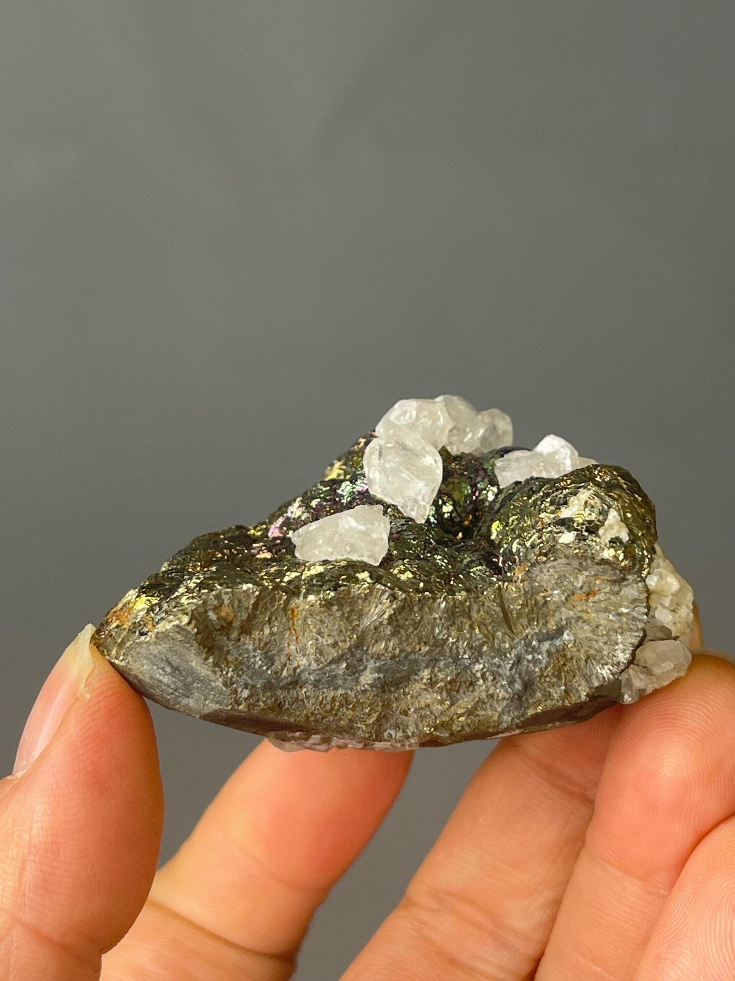 Back view of iridescent chalcopyrite cluster