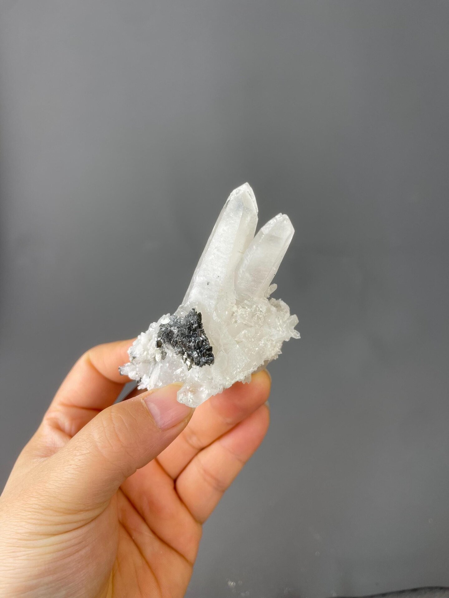 Close-up of metallic pyrite cubes amid quartz crystals
