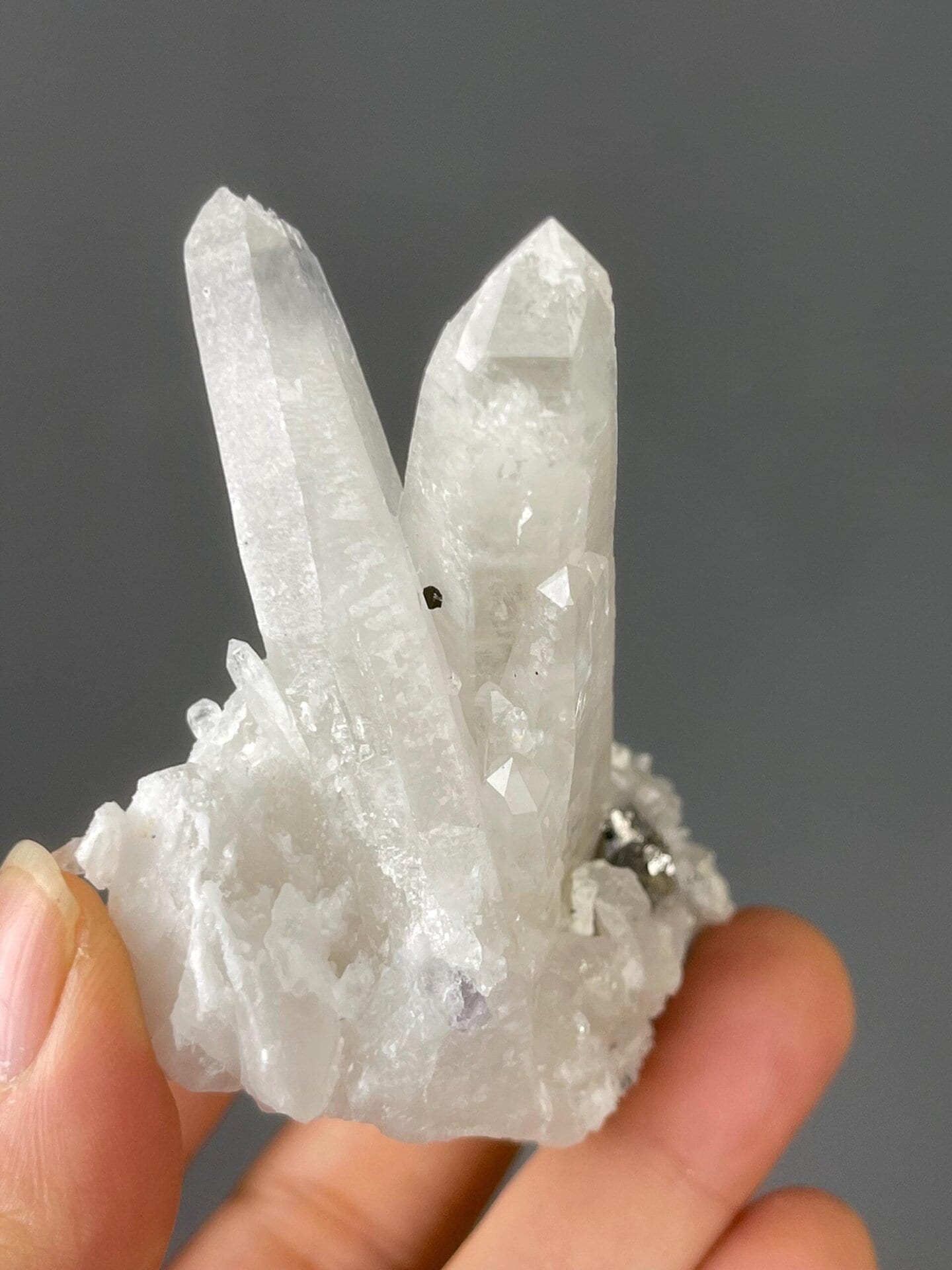 Quartz and pyrite specimen from YGX under studio lighting
