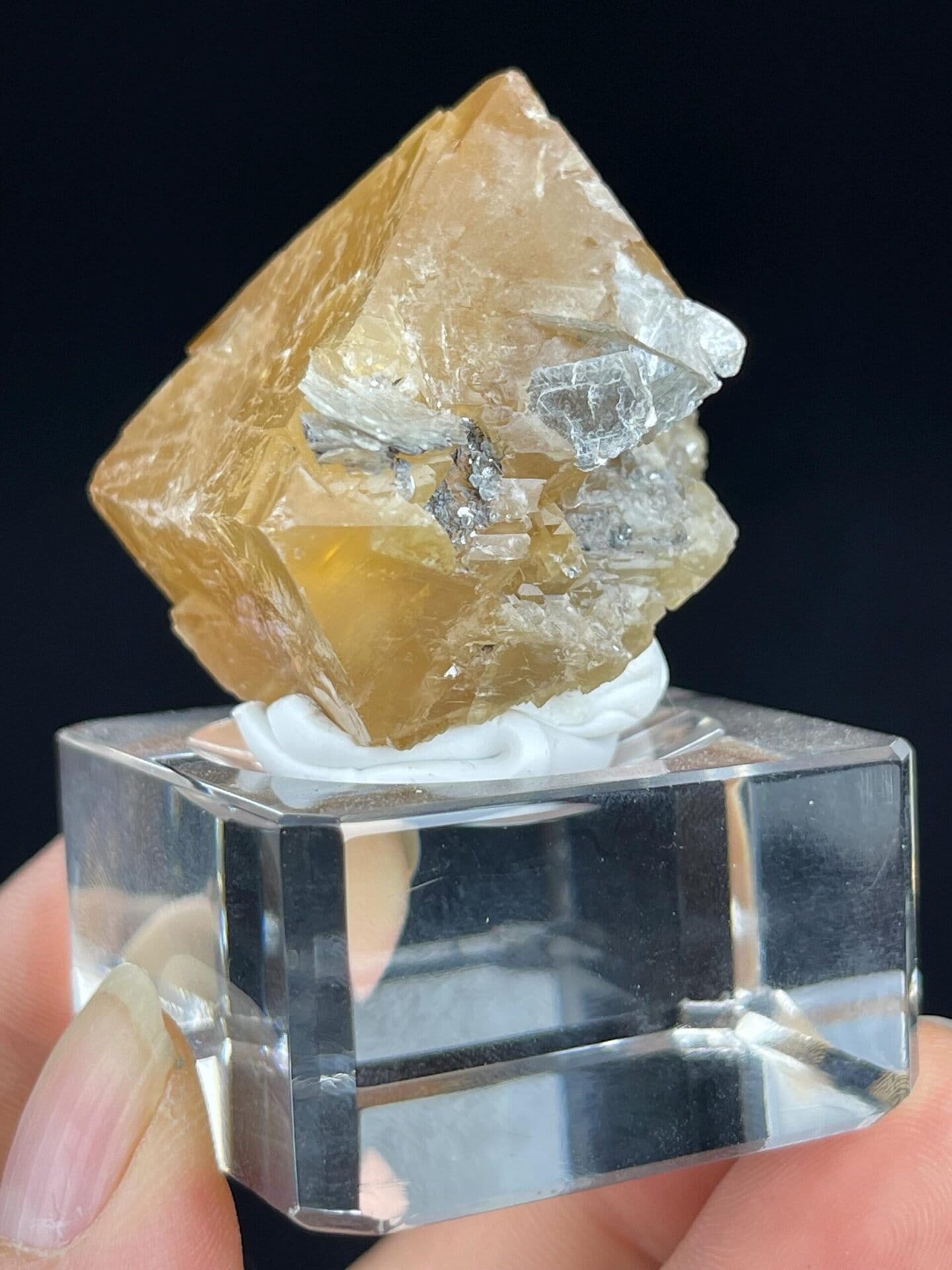 Scale reference of orange scheelite octahedron specimen