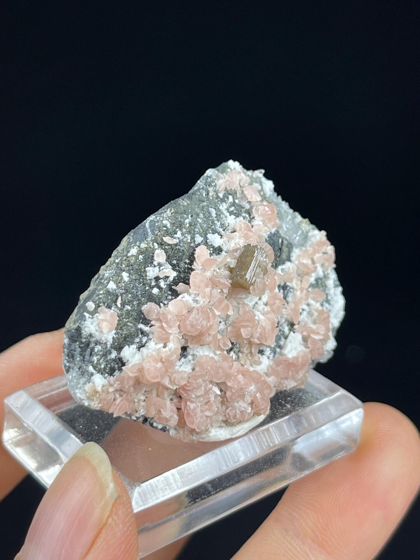 Side view of rhodochrosite mineral specimen