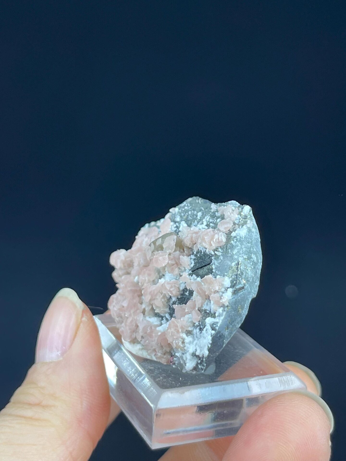 Back view of rhodochrosite on white matrix