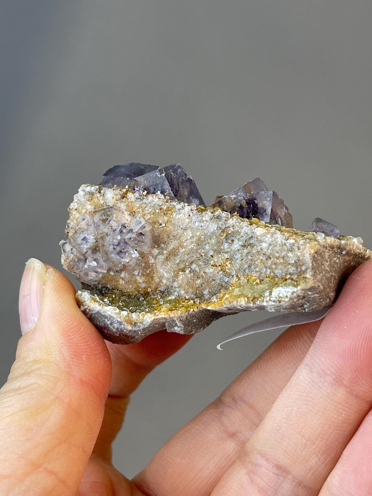 Clear fluorite crystal with purple internal inclusions