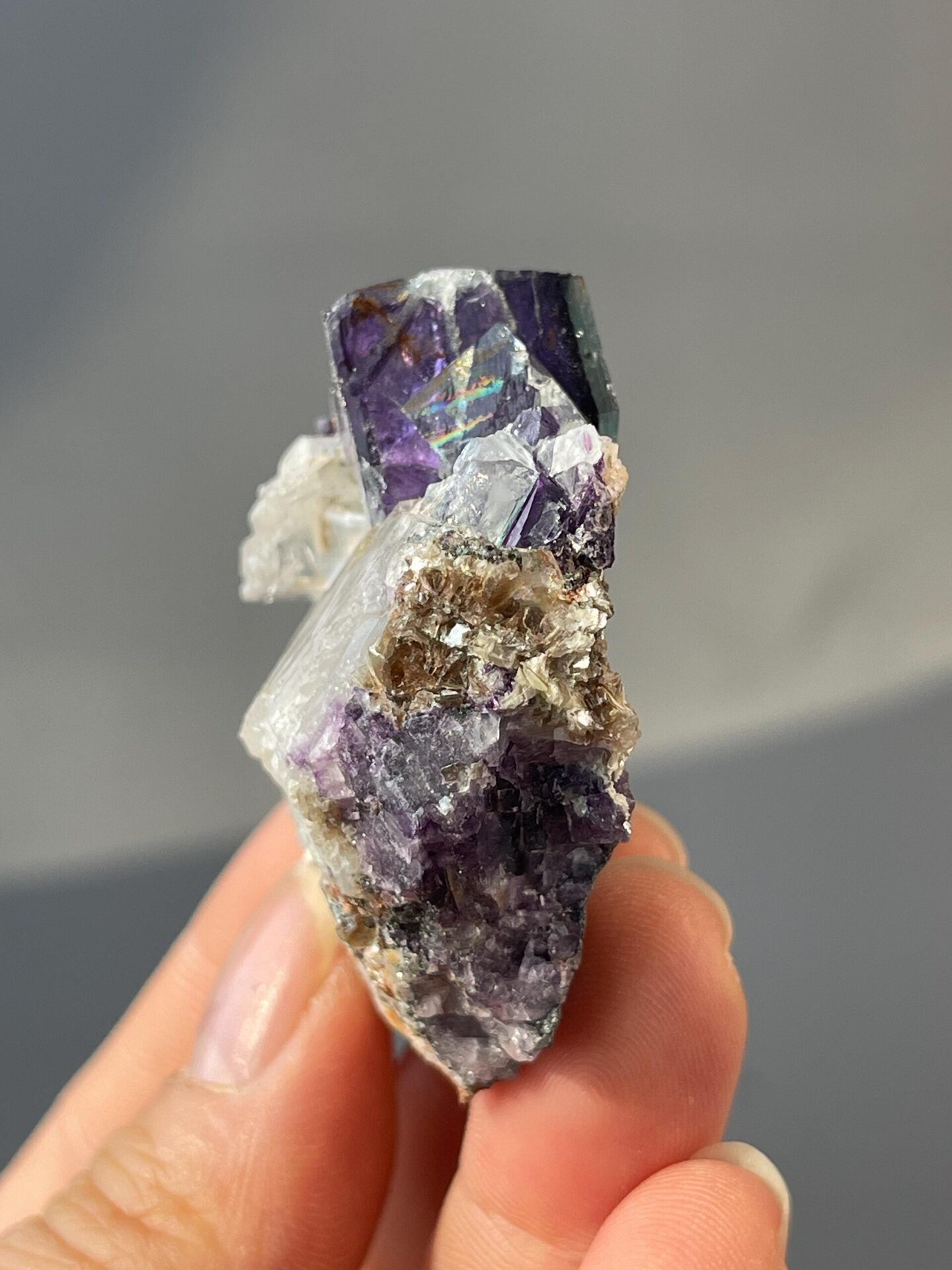 Deep purple twinned fluorite under studio lighting
